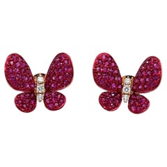 Boucles d'oreilles papillon en or rose 18 carats et rubis