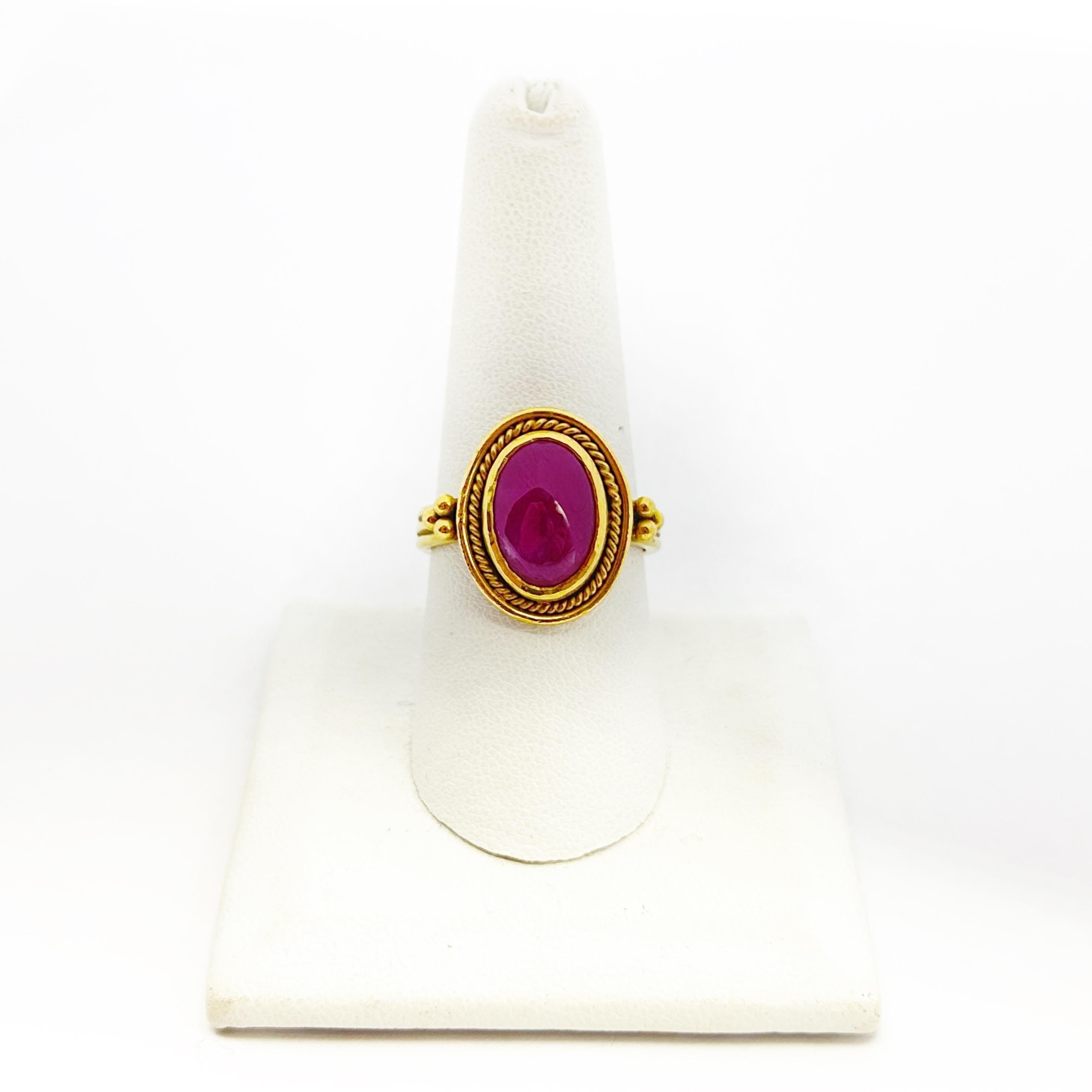 This stunning ruby ring is handmade of 22 karat gold. It was designed and Made in Montecito California by Daniel Gibbings. He is a South African designer that owns and operates a design studio there. His pieces are unique and one of a kind. The ruby