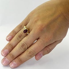 Ruby Cabochon and Round Diamond 3 Stone Ring in Yellow Gold