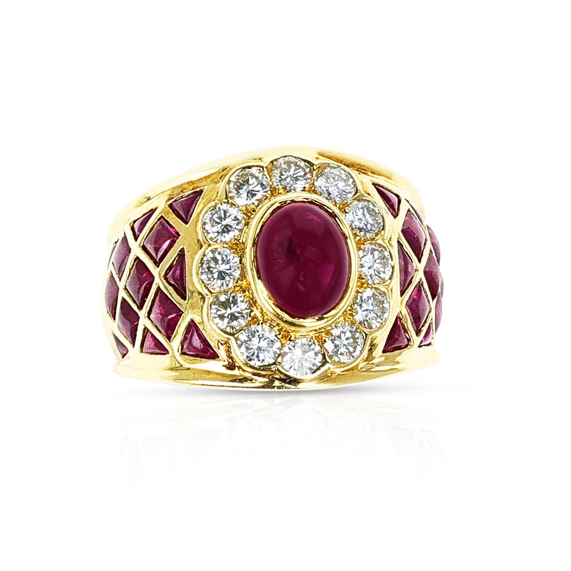 A Ruby Cabochon Cocktail Ring with Rubies and Diamonds made in 18 Karat Yellow Gold. The total weight of the ring is 14.30 grams. The ring size is US 6.  The diamonds weigh appx. 0.95 carats and the rubies are appx. 4 cts.