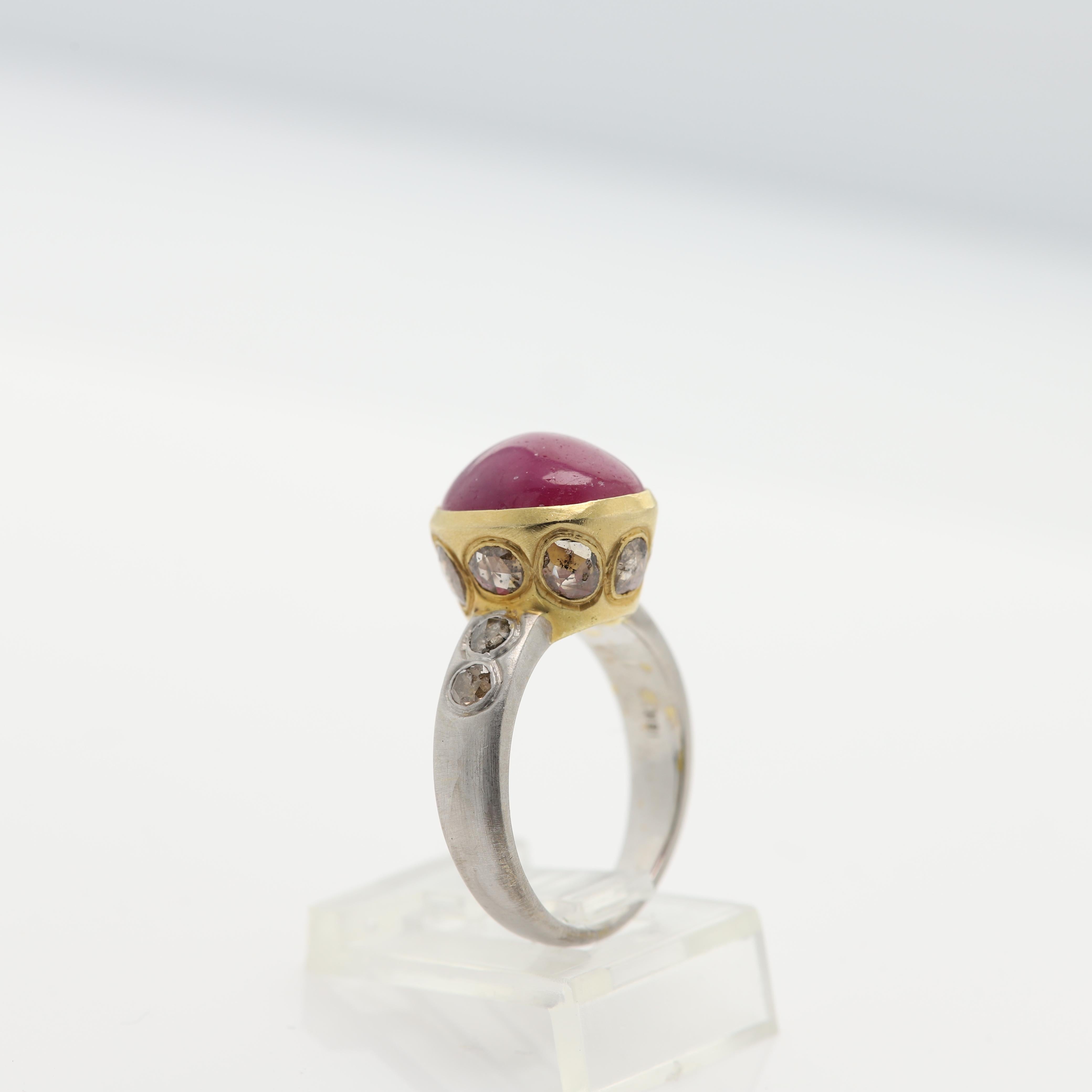 Vintage Ruby & Diamonds - Hand Made in Italy
18k Two Tone Yellow & White Gold 8.40 grams - mat finish (not shiney gold)
Ruby Cabochon 5.60 Carat Oval shape and Dome  approx size 12 x 10 mm Dark Red Tone & Bezel set.
Old Cut Light Brown Diamonds on