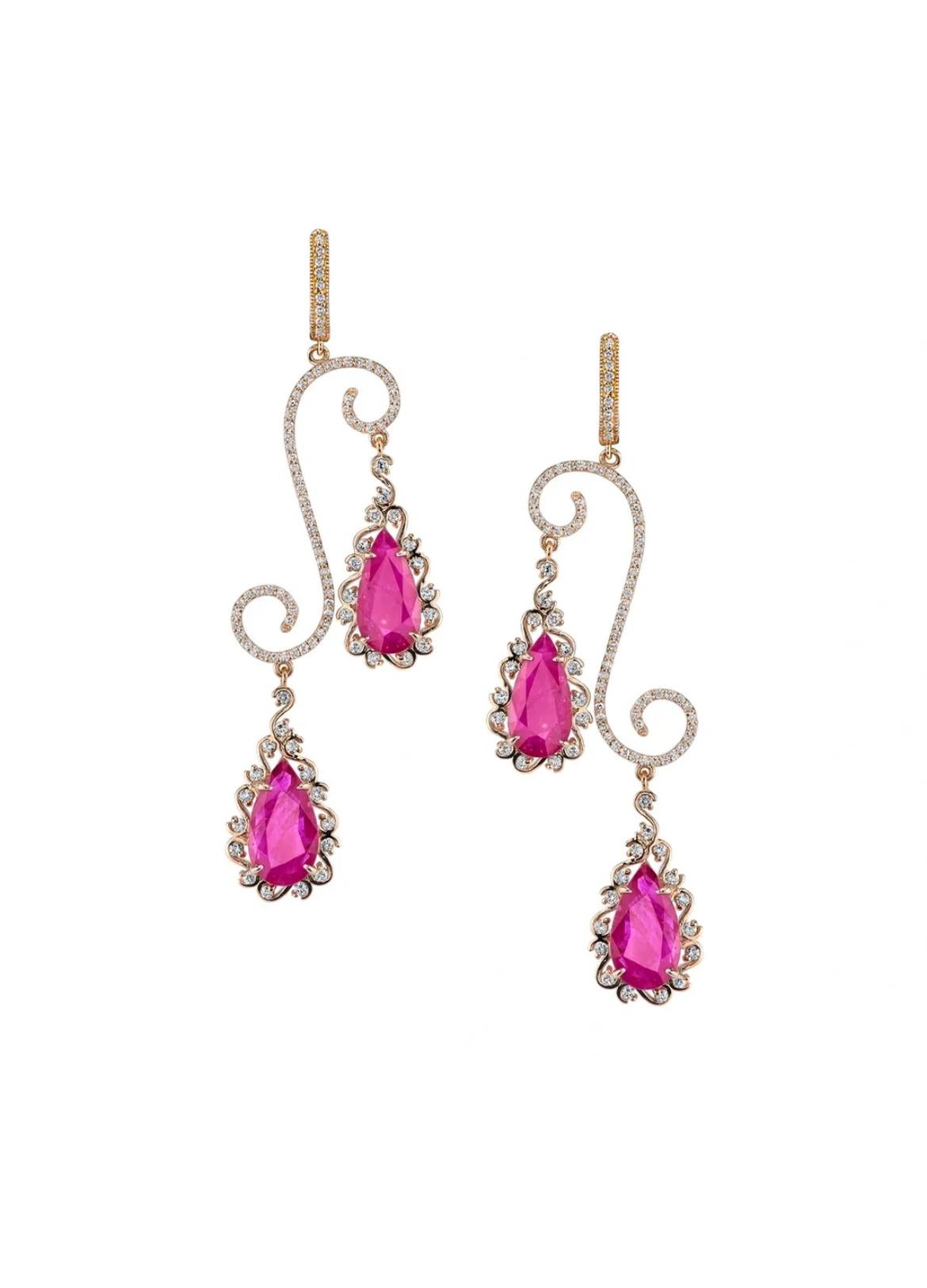 These sensational earrings showcase 15.06 carats of Mozambique Rubies beautifully complemented by 2.37 carats of glistening white diamonds set in 18K rose gold. 