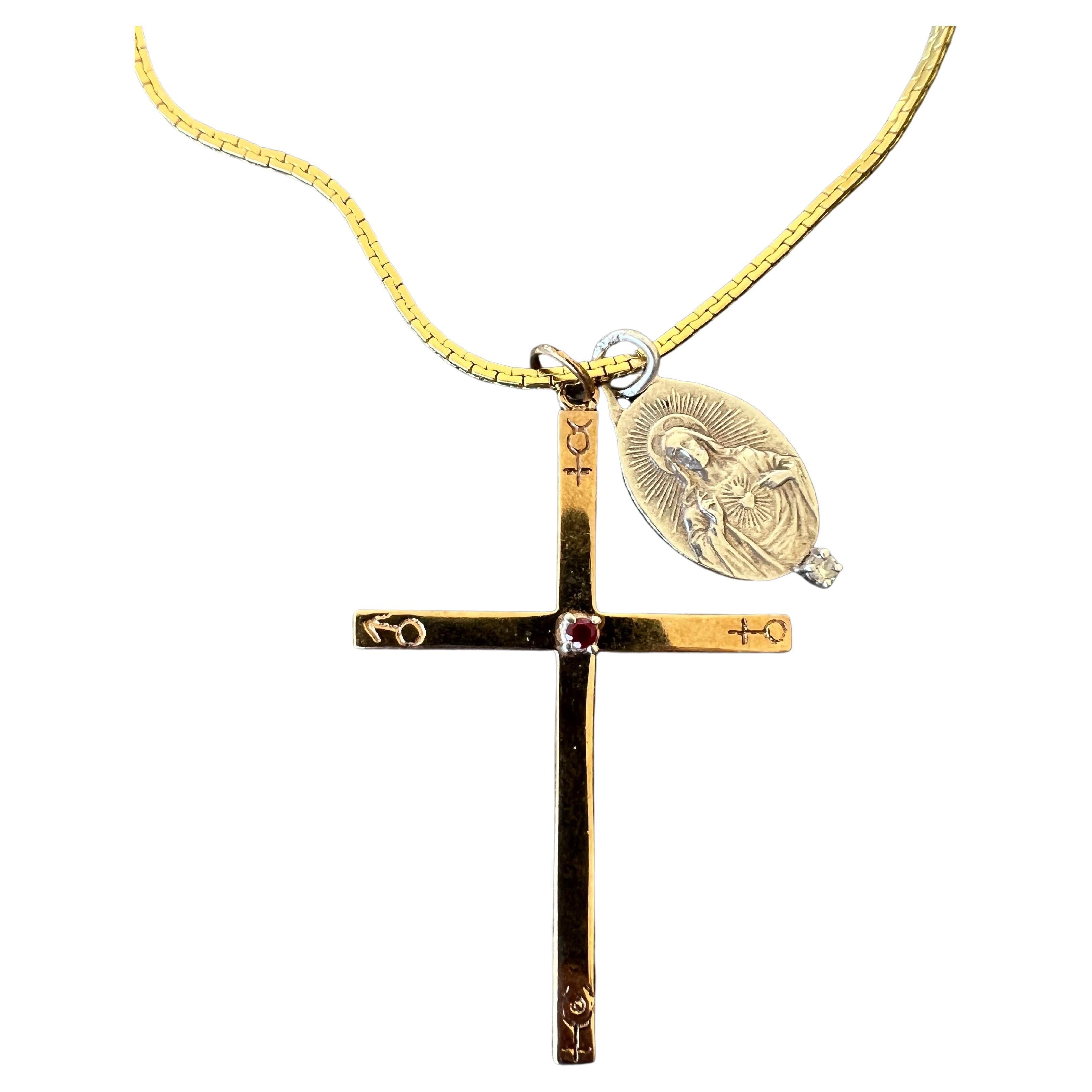 Ruby Cross Necklace Engraved Astrology Symbols White Diamond Jesus Medal

Material: Cross is in polished bronze, Jesus medal is in sterling silver and the chain itself is in gold plated brass

Approximately 28