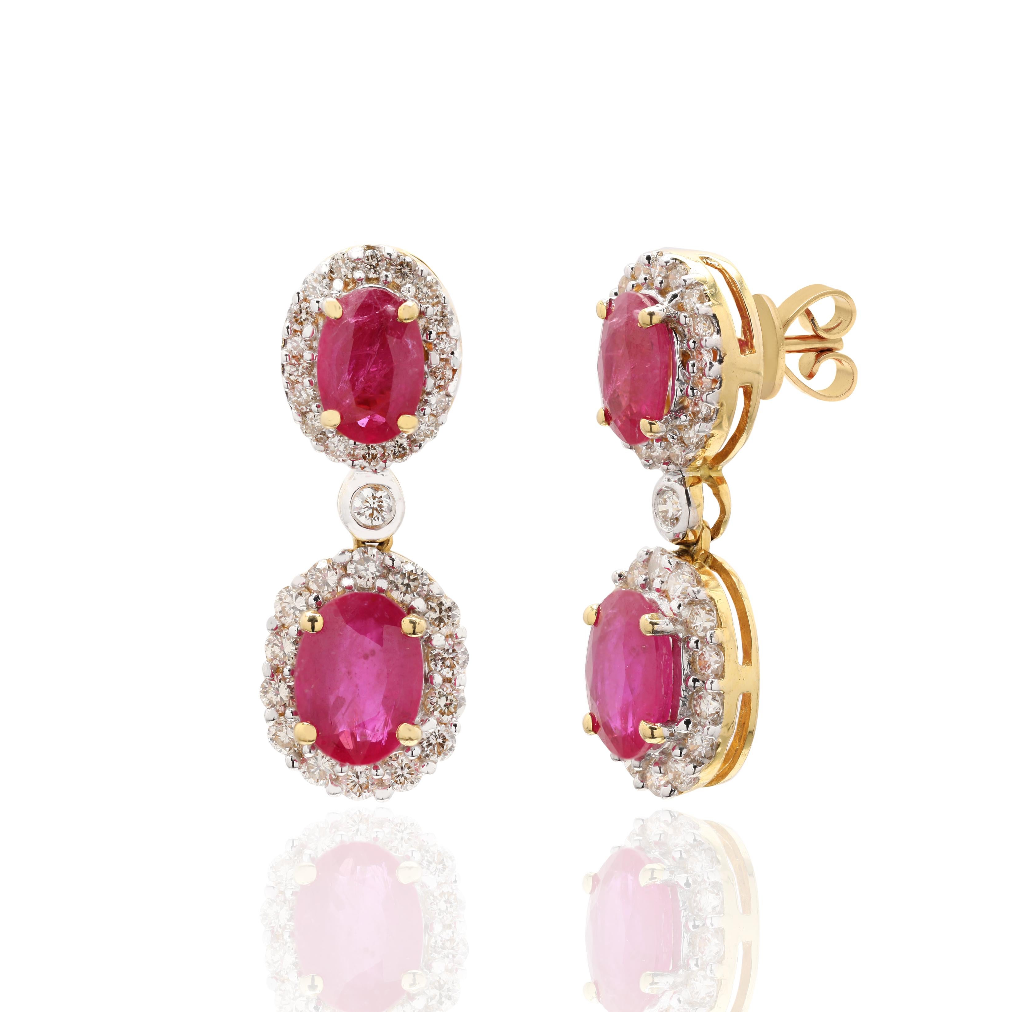 Ruby and Diamond Dangle Wedding Earrings in 18K Gold to make a statement with your look. These earrings create a sparkling, luxurious look featuring oval cut gemstone.
If you love to gravitate towards unique styles, this piece of jewelry is perfect