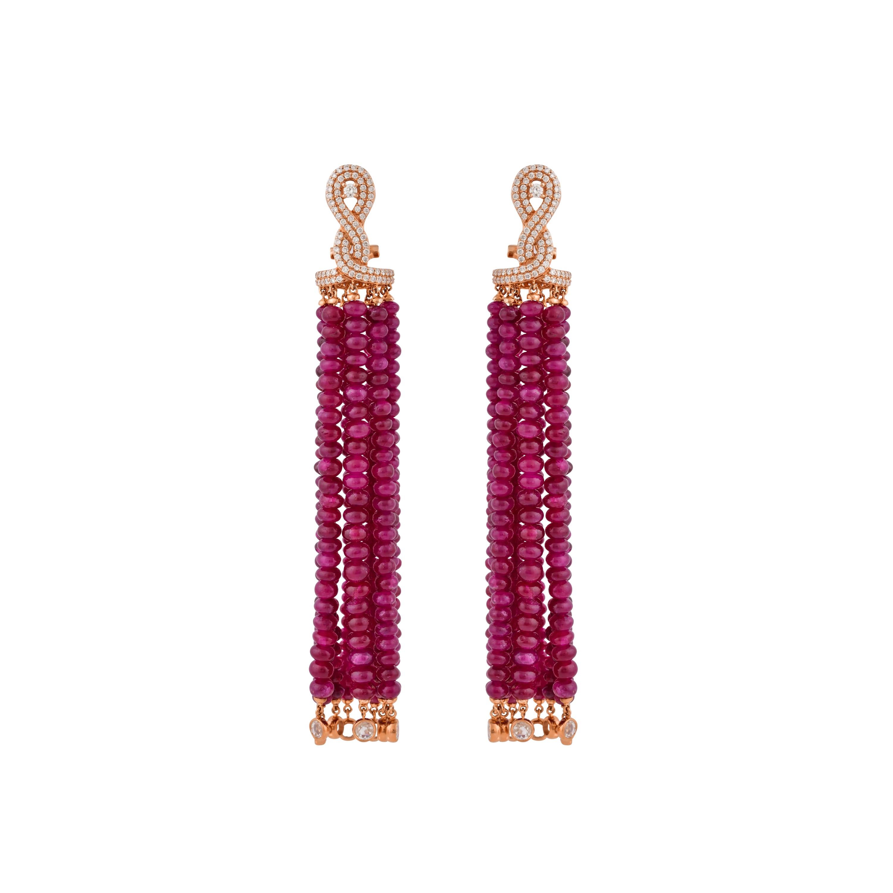 An exclusive collection of designer and unique dangle earrings by Sunita Nahata Fine Design. 

Ruby Dangle Earring in 14 Karat Rose Gold.

Ruby: 129.650 carat, Mix Size, Round Shape.
Diamond: 0.067 carat, 2.00 Size, Round Shape, G colour, VS