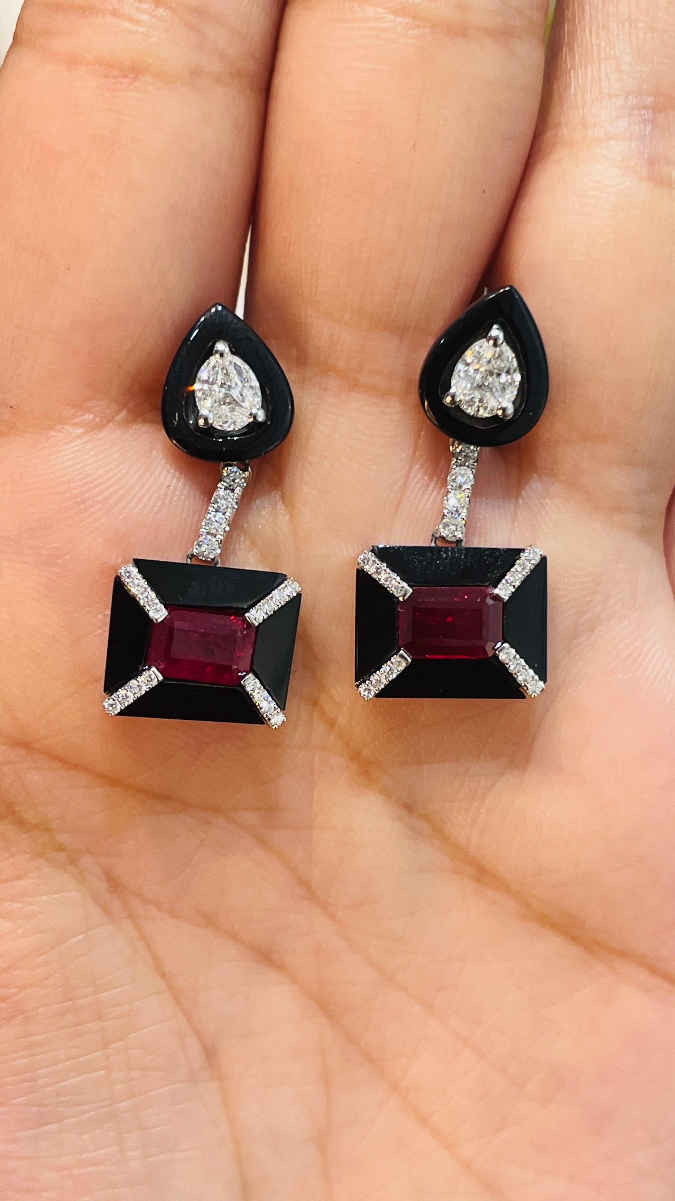 Ruby and black enameled Diamonds Dangle earrings to make a statement with your look. These earrings create a sparkling, luxurious look featuring octagon and mix cut gemstone.
If you love to gravitate towards unique styles, this piece of jewelry is