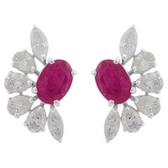 Clous d'oreilles en or 10 carats avec rubis et diamants