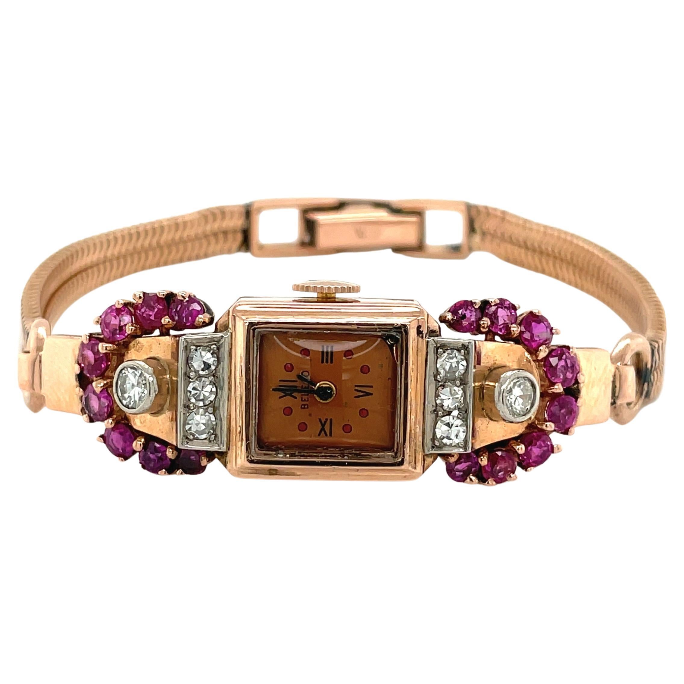 Montre-bracelet art déco en or rose 14 carats avec rubis et diamants