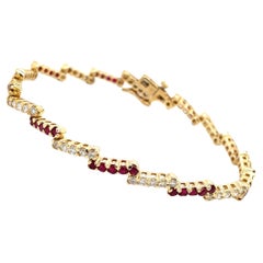 Bracciale tennis Zig Zag con diamante e rubino in oro giallo 14 carati
