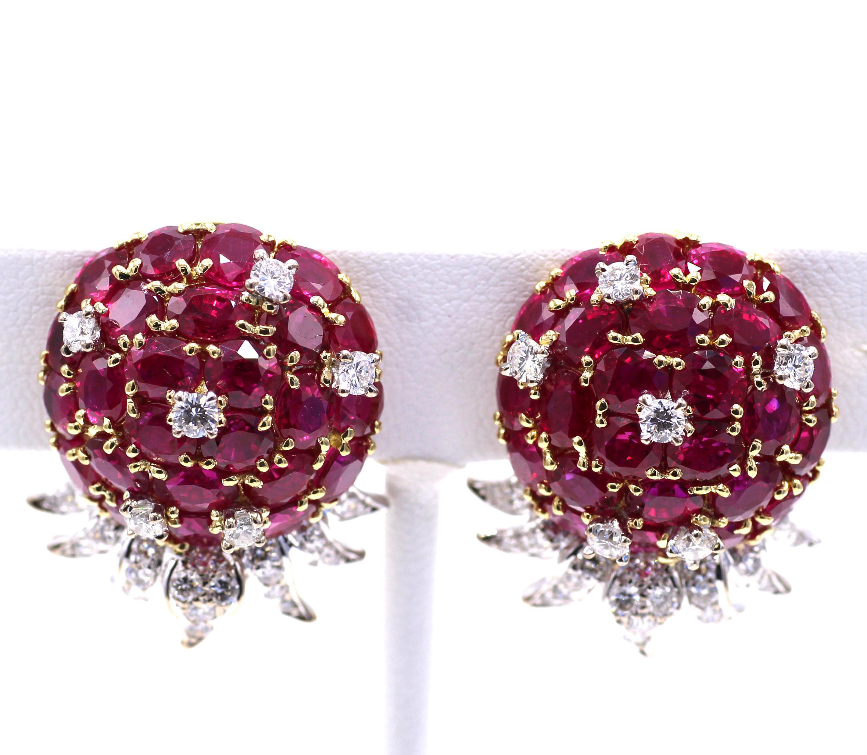 Beautifully designed and masterfully handcrafted these colorful earrings are set with 25 perfectly matched pigeon blood red rubies, in each earring embellished by 6 bright white and lively round brilliant cut diamonds. Beneath the center piece 7