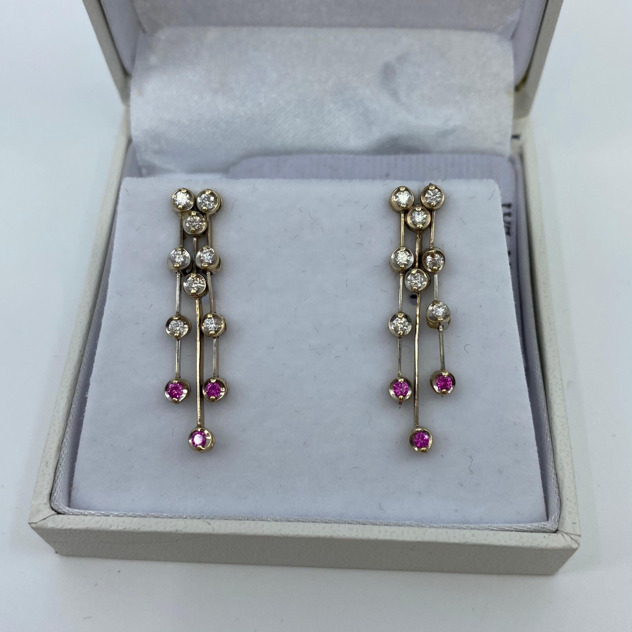 Ruby & Diamond 18 Karat White Gold Dangle Waterfall Earring Studs.

Beautifully made, with a unique design and excellent quality stones.

Earrings fastened by butterfly backs and post.
Fully hallmarked by UK Assay Office to guarantee metal