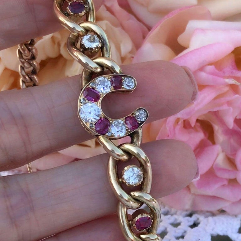Ruby and Diamond 9 Karat Yellow Gold Horseshoe Link Bracelet at 1stDibs