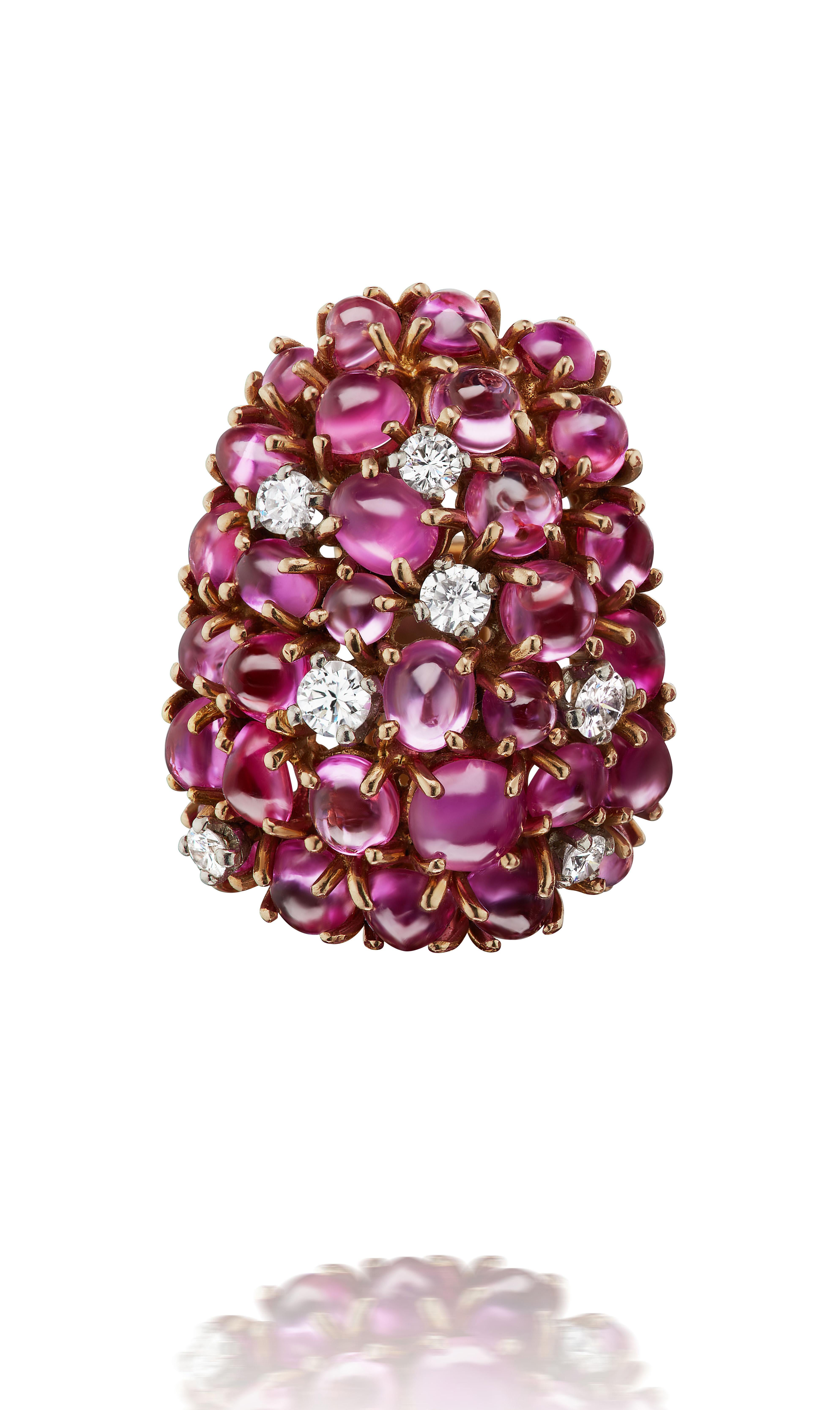 These playful and charming earclips made in France circa 1960 consist of 58 cabochon pink rubies weighing approximately 11.60 carats and 14 round brilliant diamonds weighing approximately .70 carats. 

An excellent splash of color for everyday or