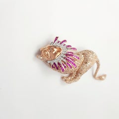 Broche Lion en rubis, diamant et diamant brun sertie en or rose 18 carats