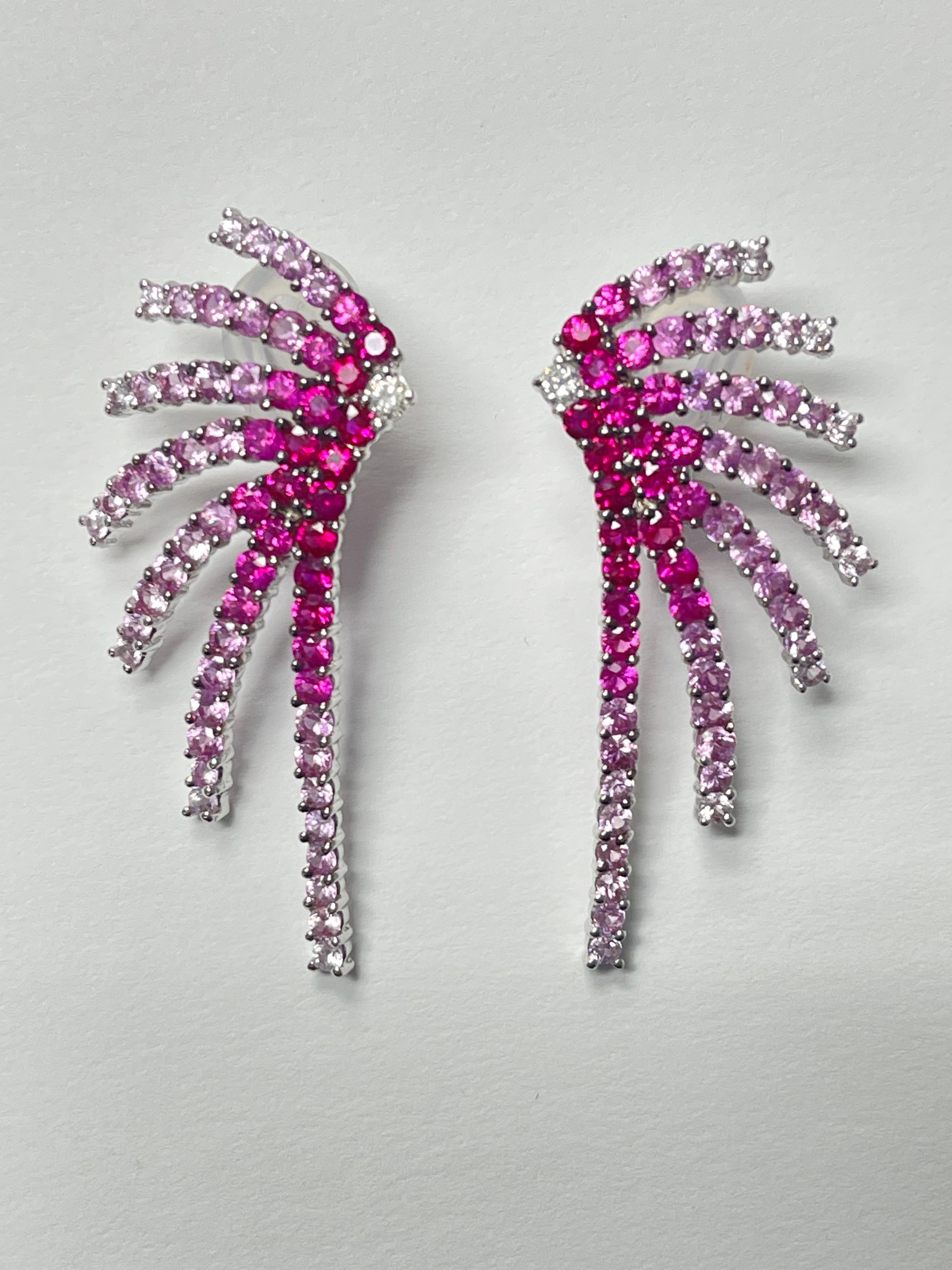 Ruby Diamond and Pink Sapphire fire cracker earrings in 18 karat white gold. 
The details are as follows: 
Ruby and Sapphire weight : 6 carats 
Gold : 13 grams (8.4 dwt ) 
Measurements : 1.75 inches long 



