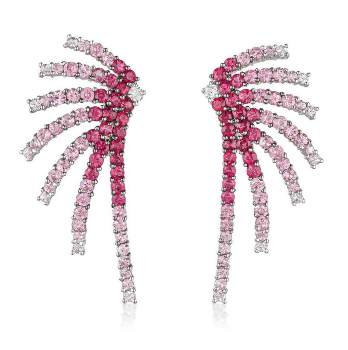 Ruby Diamond and Pink Sapphire fire works earrings in 18 karat white gold. 
The details are as follows: 
Ruby and Sapphire weight : 6 carats 
Diamond weight : 0.18 carat with G color and VS clarity 
Gold : 13.40 grams (8.4 dwt ) 
Measurements : 1.75