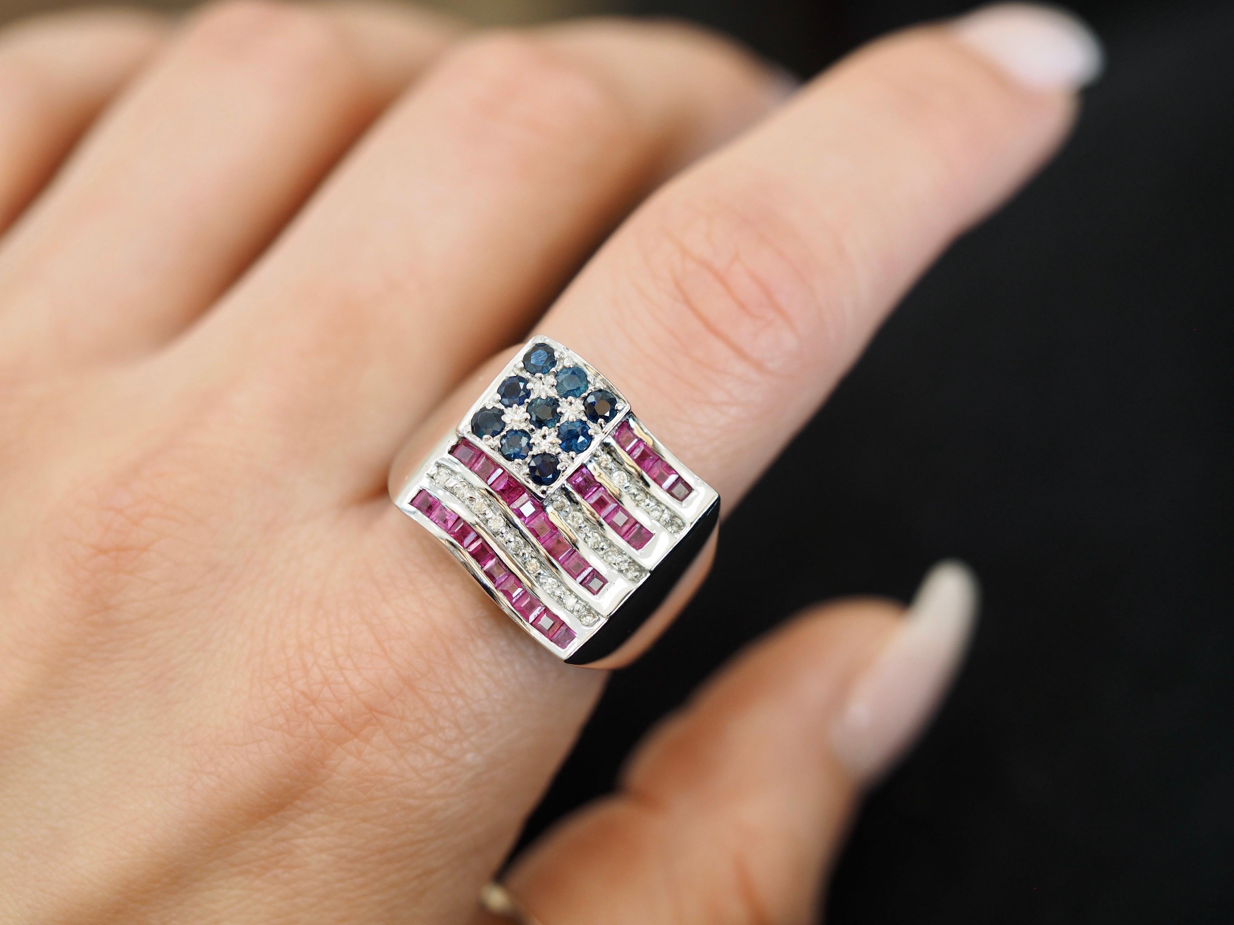 Beautiful American Flag statement ring. This ring is made up of red rubies, white diamonds and blue sapphire set in 14 karat white gold. The way the ring was created allows for the perfect fit on the finger. Size 8, can be sized up or down