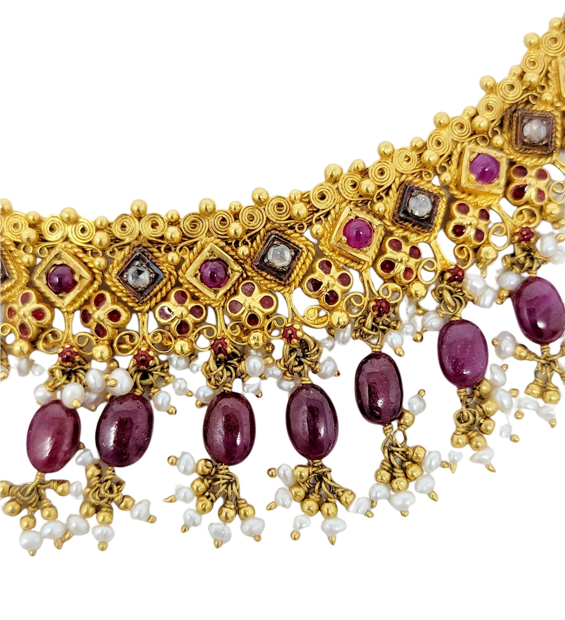 This stunning multi-colored choker necklace is an absolute work of art!  Filled with movement, color and personality, this one-of-a-kind necklace will absolutely radiate on the neck. The luxurious 22 karat yellow gold piece is embellished with