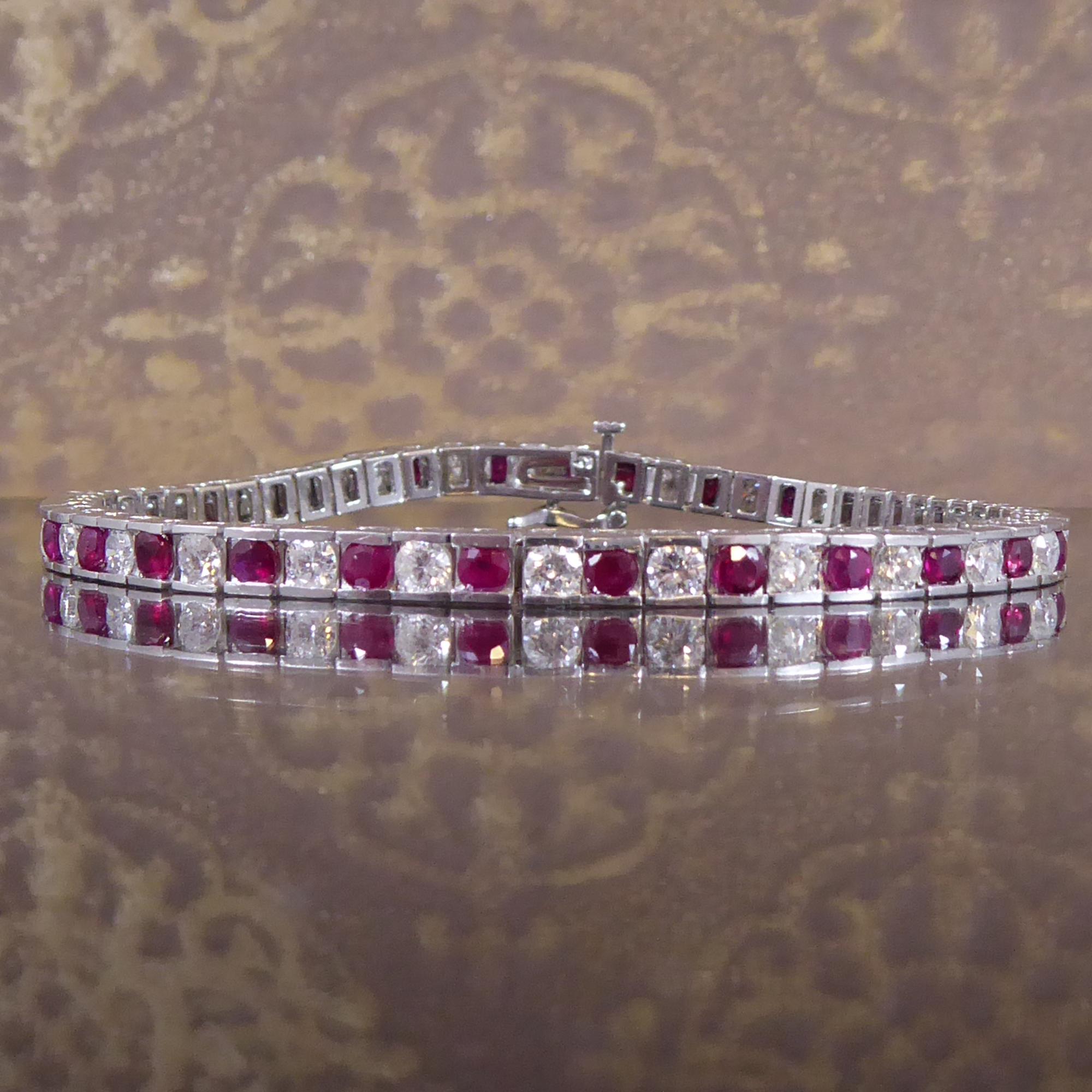 A pre-owned ruby and diamond tennis bracelet resplendent with 29 round, mixed cut rubies of medium to dark colour channel set into articulated rectangular settings and alternating with 28 round brilliant cut diamonds.  The rubies, which measure