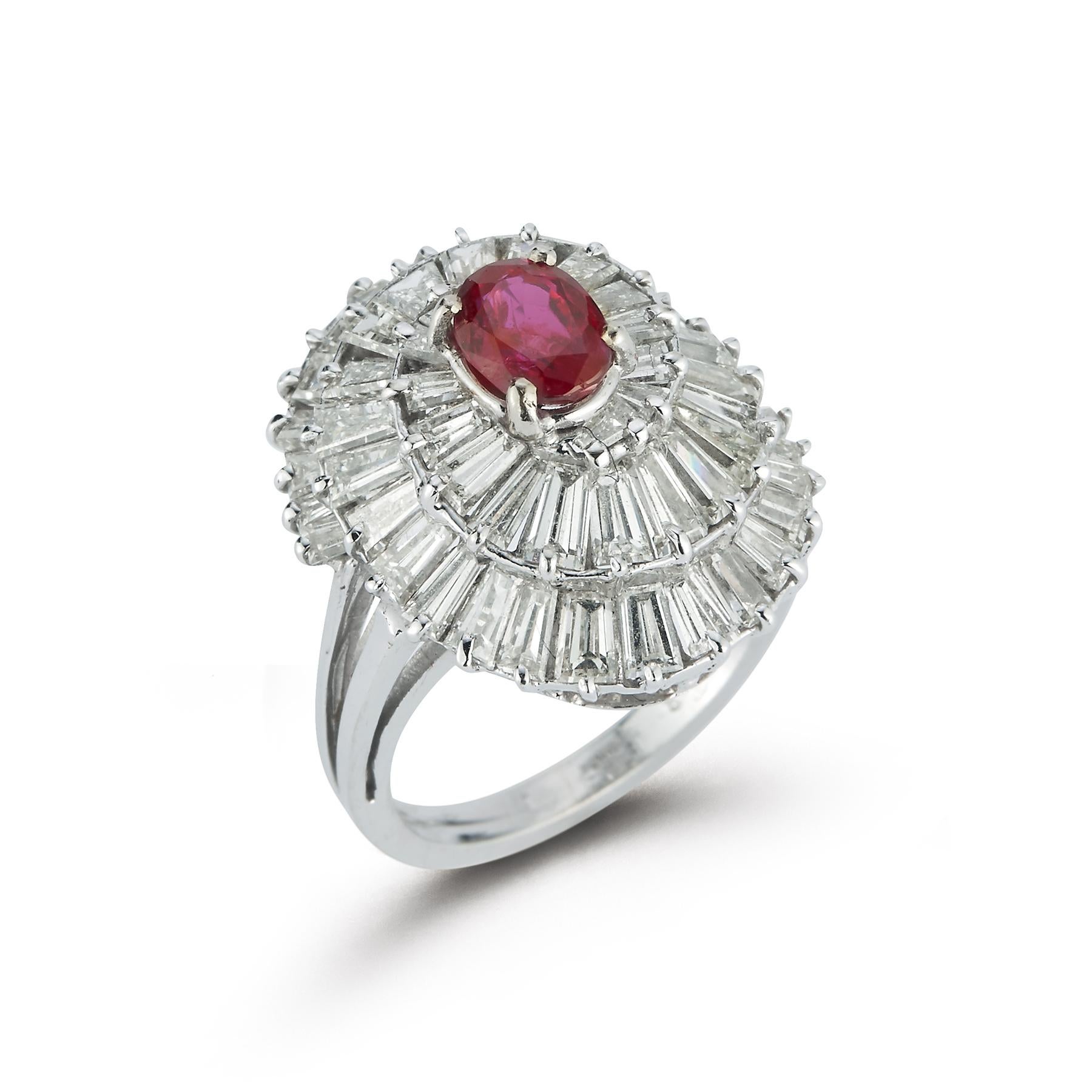 Ruby & Diamond Ballerina Cocktail Ring
Center Oval Ruby approximately .94 Carat,
Surrounded by a Beautiful Array of Baguette Diamonds approximately 3.75 cts

Ring Size 5.25

Resizable Free of Charge

Gold Type: 14K White Gold 