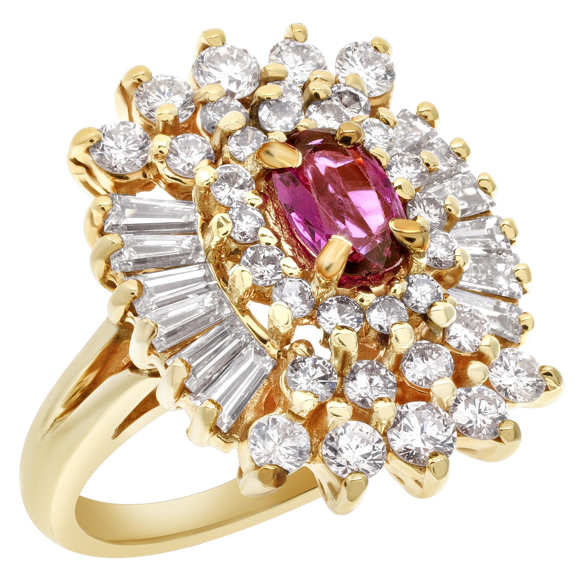 Ballerina ruby & diamond ring in 14k yellow gold with approximately 1.28 carats in round and baguette diamonds. Dimensions at head: 16.2mm x 20.5mm. Width at shank: 1.6mm. Size 5.25.  This Ruby ring is currently size 5.25 and some items can be sized