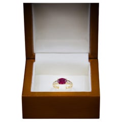 Anello con diamante e rubino in oro 18 K