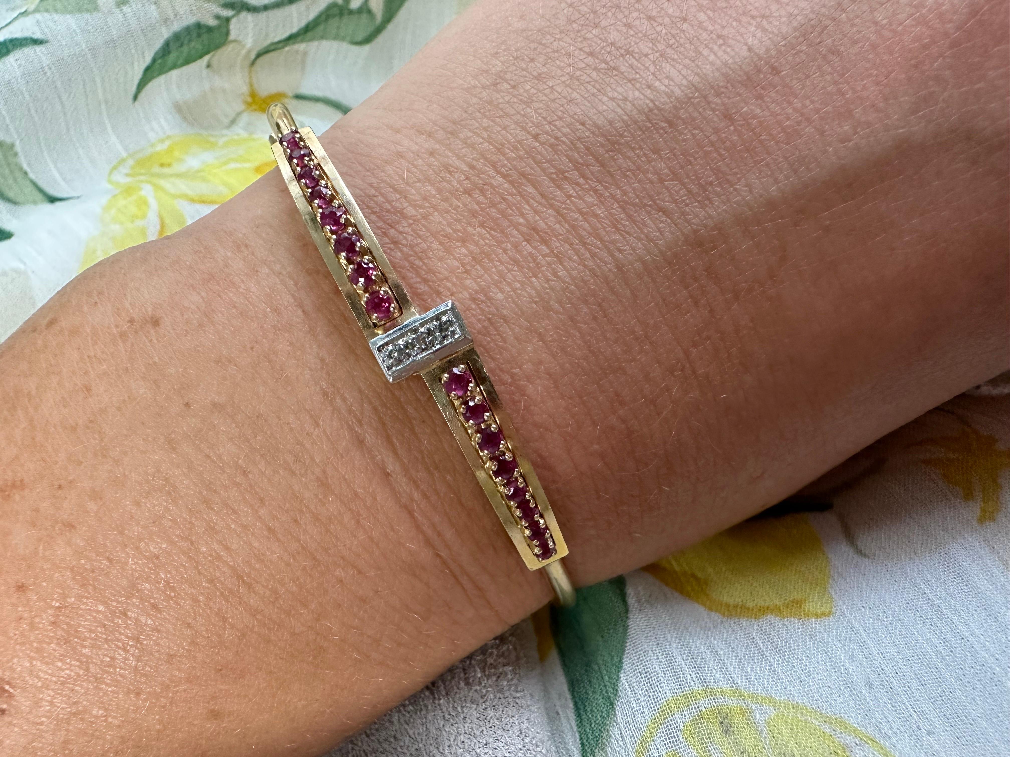 Diamond and Ruby bangle bracelet in 14KT yellow gold, beautiful and comfortable!

METAL: 14KT yellow gold
Grams:8.50
Item24000010 aft

WHAT YOU GET AT STAMPAR JEWELERS:
Stampar Jewelers, located in the heart of Jupiter, Florida, is a custom jewelry
