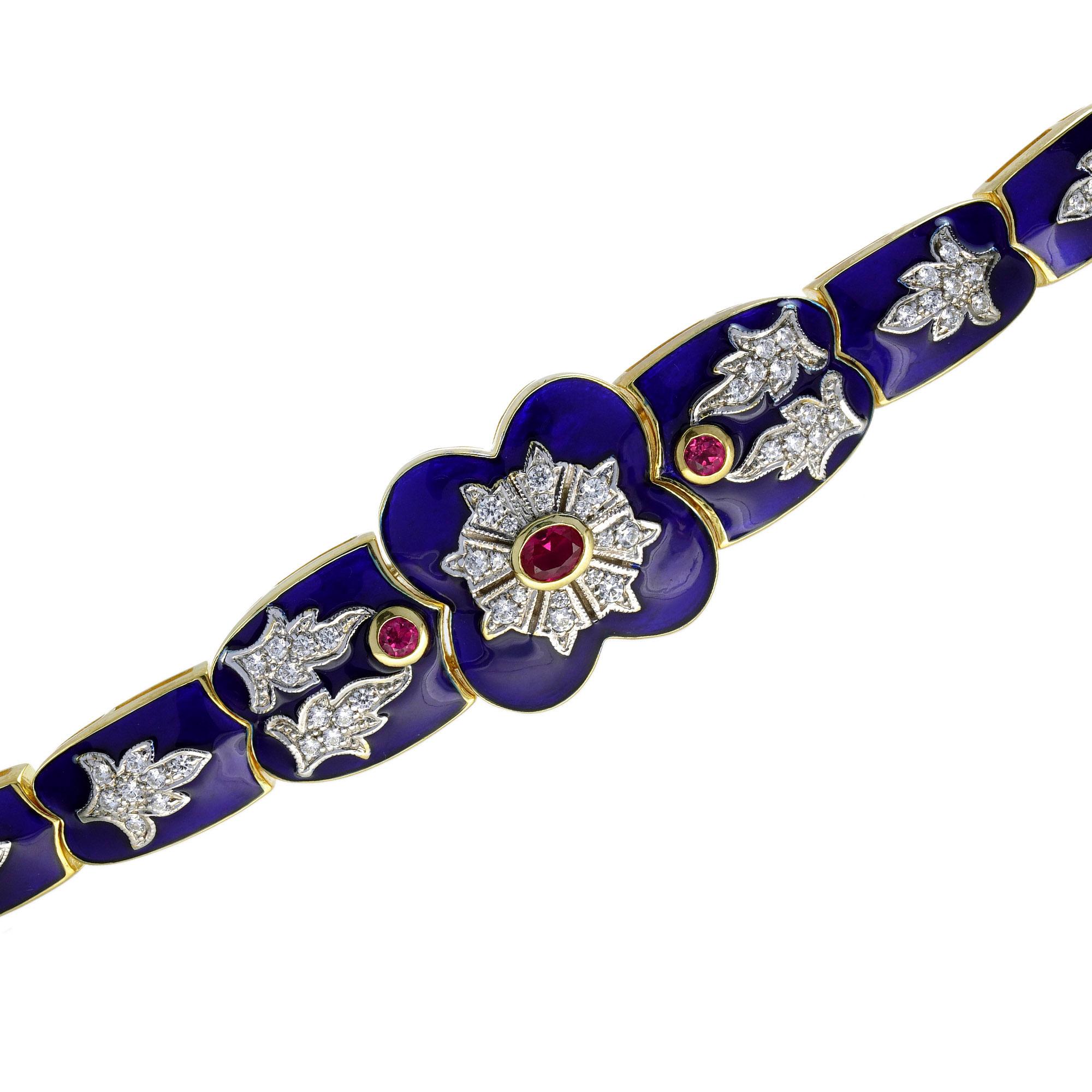 This Victorian inspired bracelet will make a lasting impression. Hand fabricated in yellow gold, the front side of this cold and beautiful bracelet features a trio of small rubies in the center, accented by glittering diamonds. The gemstones are