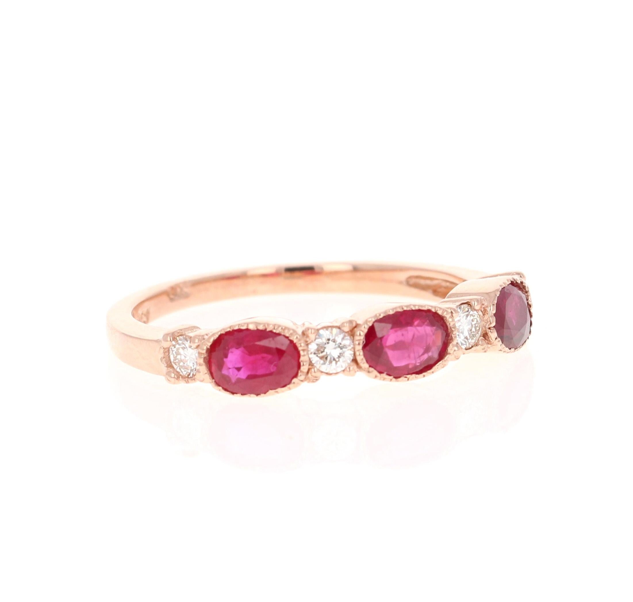 This ring has 3 Oval Cut Rubies that weigh 1.09 carats and 4 Round Cut Diamonds that weigh 0.17 carats. (Clarity: VS, Color: H) The total carat weight of the ring is 1.26 carats. 

The ring is designed in 14 Karat Rose Gold and weighs approximately