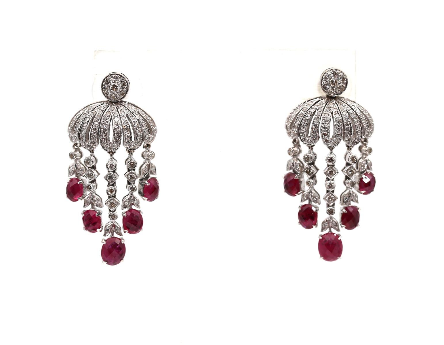 14K White Gold Ruby Diamond  Chandelier Earrings, 1980

Pair of 14K White Gold Ruby Diamond Earrings. An elegant pair of chandelier earrings with milgrain finish. Containing numerous round brilliant and single cut Diamonds weighing approximately
