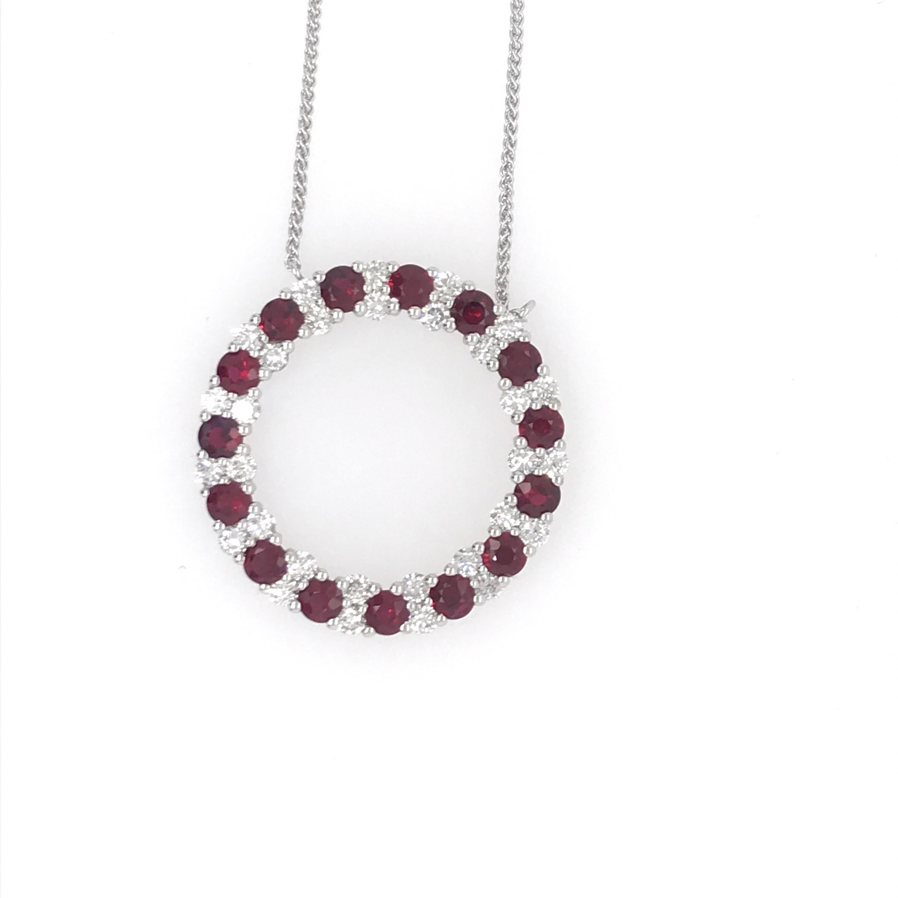 18K White gold circle pendant necklace featuring 15 red rubies weighing 2.58 carats and 30 round brilliants weighing 1.31 carats.
Color G-H
Clarity SI