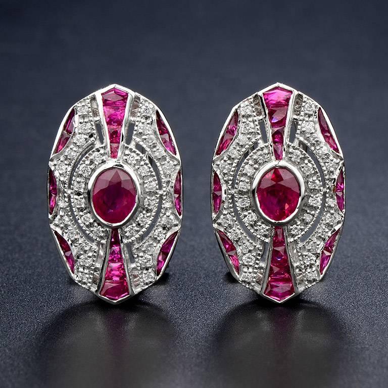 Oval Shape Burmese Ruby 2 pieces 0.82 Carat in the center. Surrounded by 64 pieces 0.40 Carat Diamond and French Cut Ruby 40 pieces 3.00 Carat. Set on 18K White Gold Clip-on Earrings.