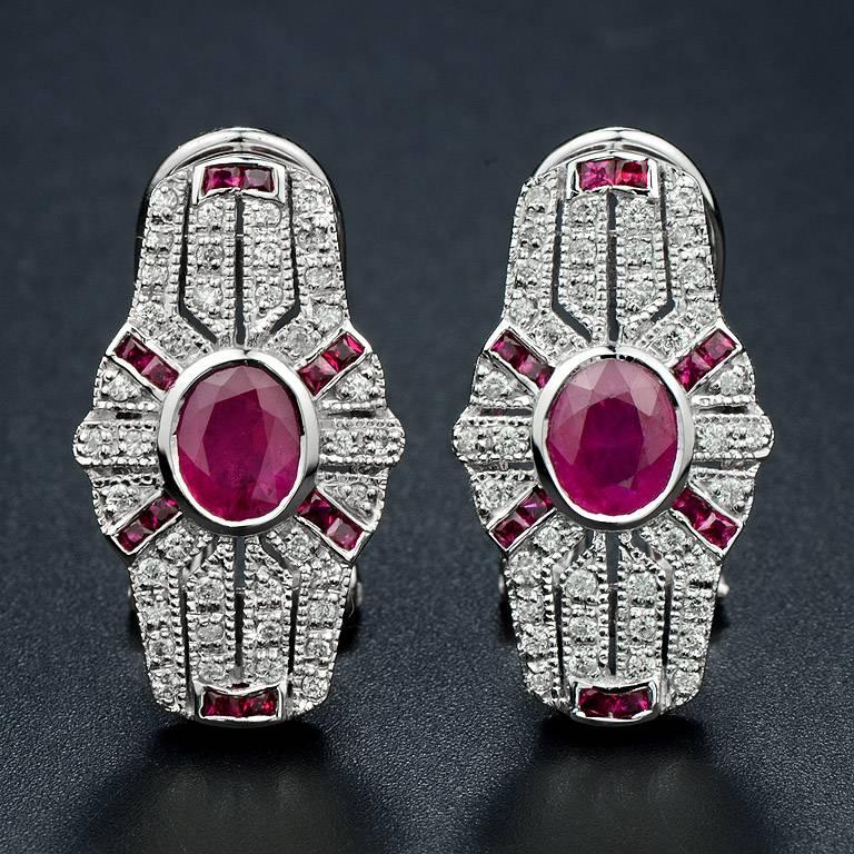 Oval Shape Burmese Ruby 2 pieces 1.62 Carat in the center hi-lighted by 24 pieces 0.50 Carat French Cut Ruby and sparkling with 80 pieces 0.42 Carat Diamond.  This earring was Set on 18K White Gold Clip-on Style.