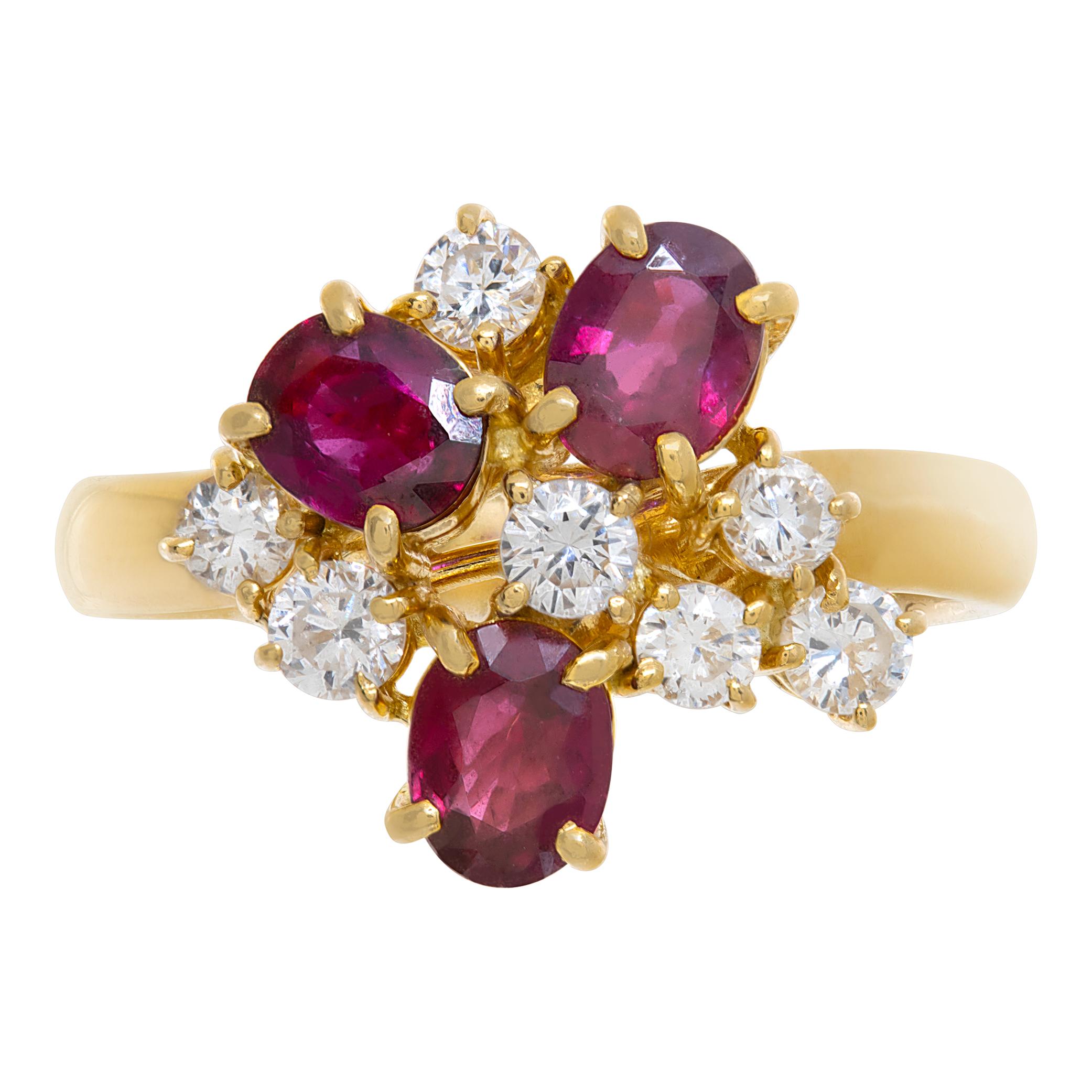 Ruby & diamond cluster ring in 18k yellow gold with approximately 1/2 carat in oval rubies & 1/2 carat in round brilliant cut diamonds. Size 7.

This Diamond/Ruby ring is currently size 0 and some items can be sized up or down, please ask! It weighs