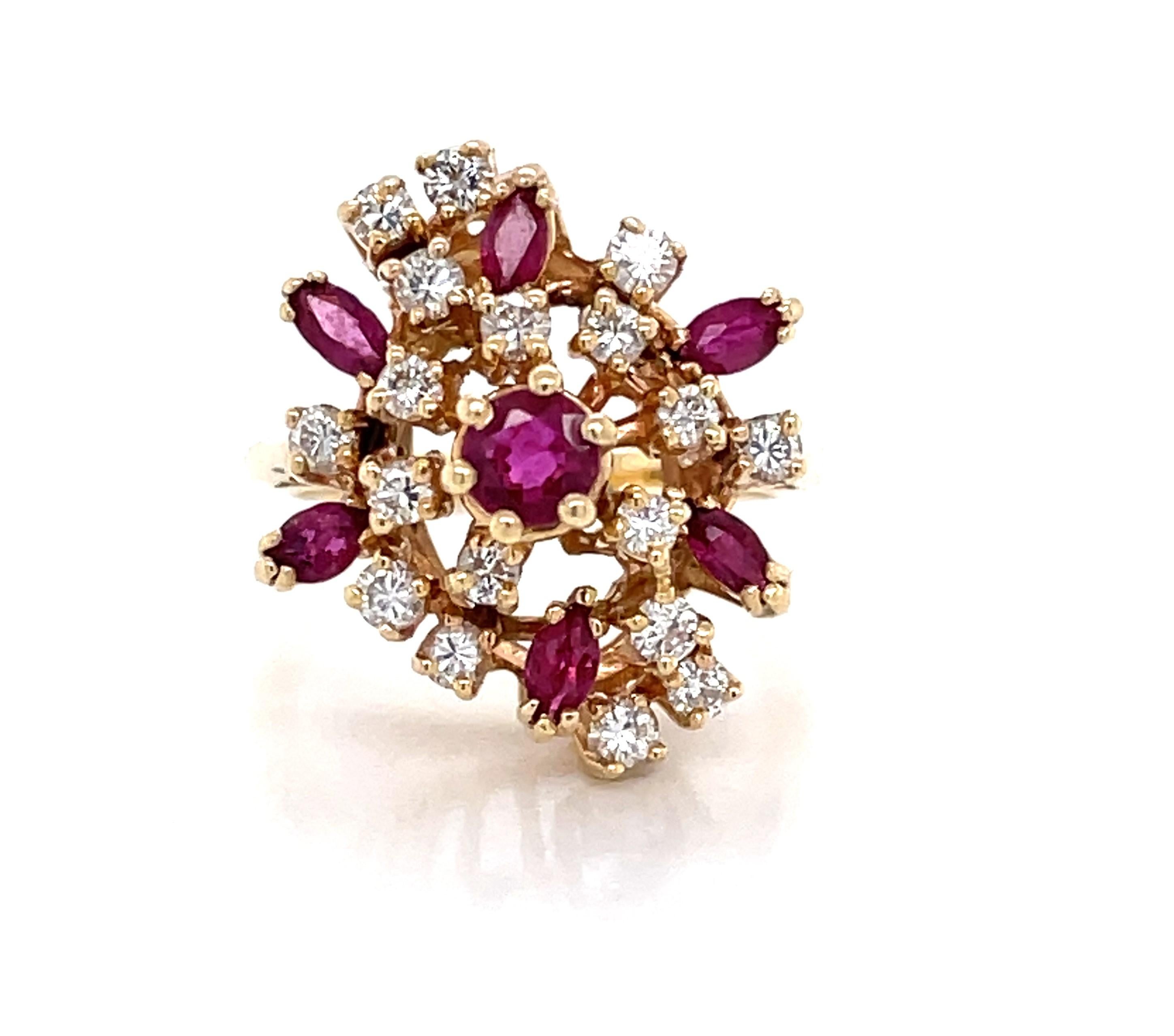 Bright and elegant with added flair this ring is set asymmetrical with a sparkling cluster arrangement of rubies and diamonds each prong set and graduating towards a larger center ruby gemstone. The glistening floral burst is is comprised of seven