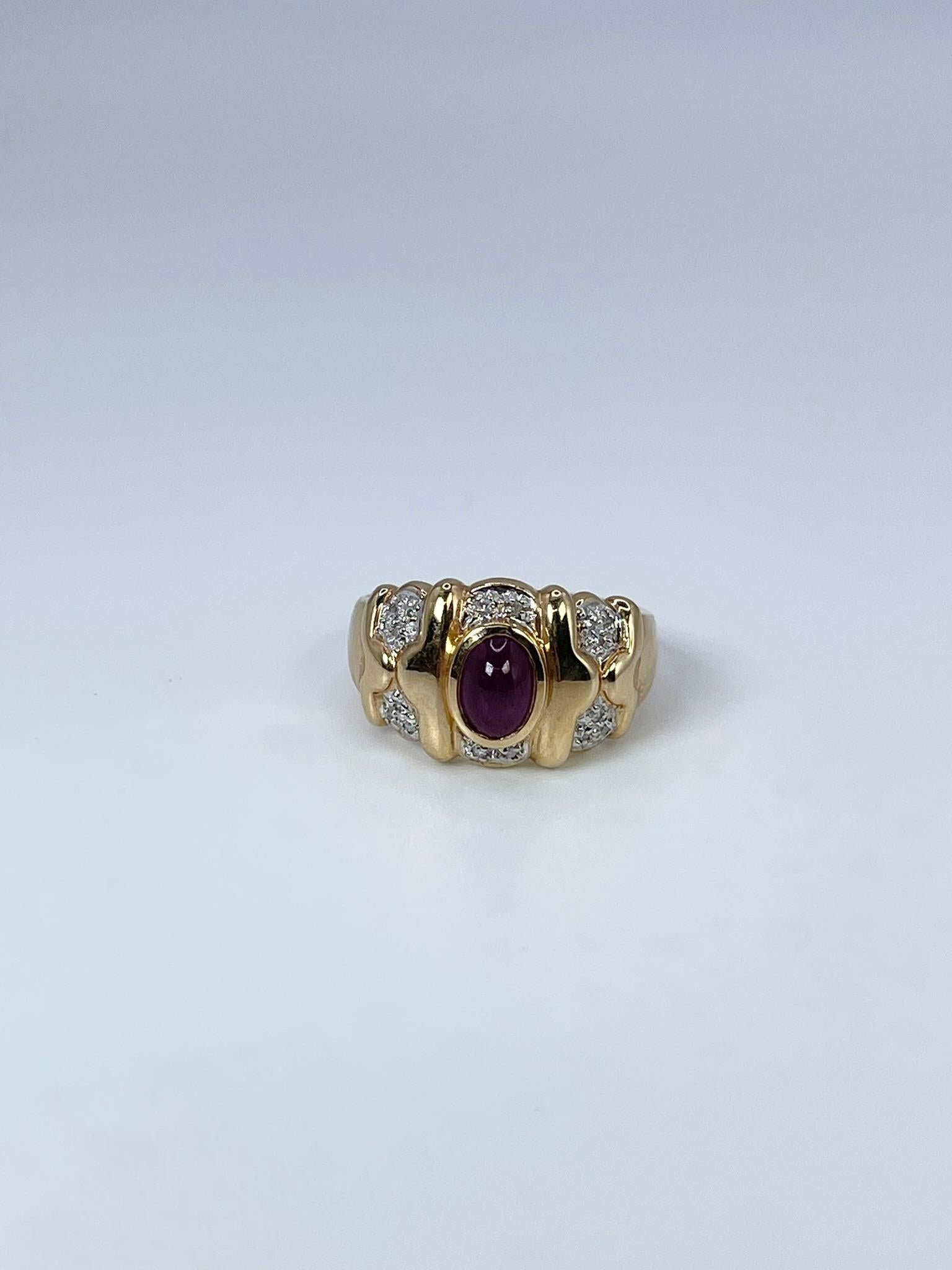 Stunning ruby & diamond cocktail ring made with oval cabochon (100% natural and untreated ruby) in 14KT yellow gold.

GRAM WEIGHT: 4.58gr
METAL: 14KT yellow gold

NATURAL DIAMOND(S)
Cut: Round
Color: H 
Clarity: SI (average)
Carat: 0.06ct

NATURAL