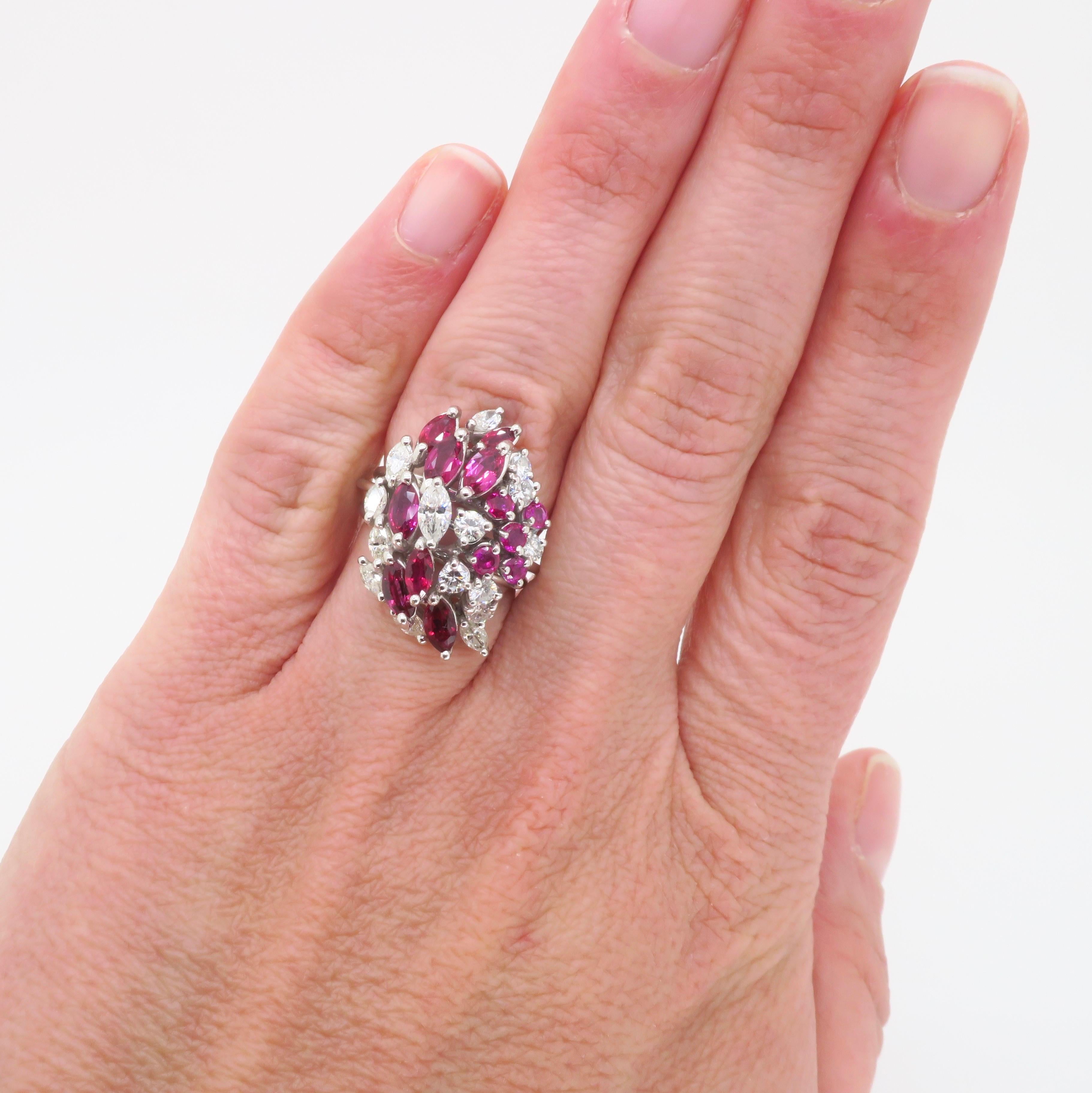 Multi-shaped Ruby & Diamond Cluster ring made in Platinum. 

Gemstone: Ruby and Diamond
Diamond Carat Weight: Approximately 1.05CTW
Diamond Cut: Round Brilliant & Marquise Cut
Color: Average F-G
Clarity: Average VS
Metal: Platinum 
Marked/Tested: