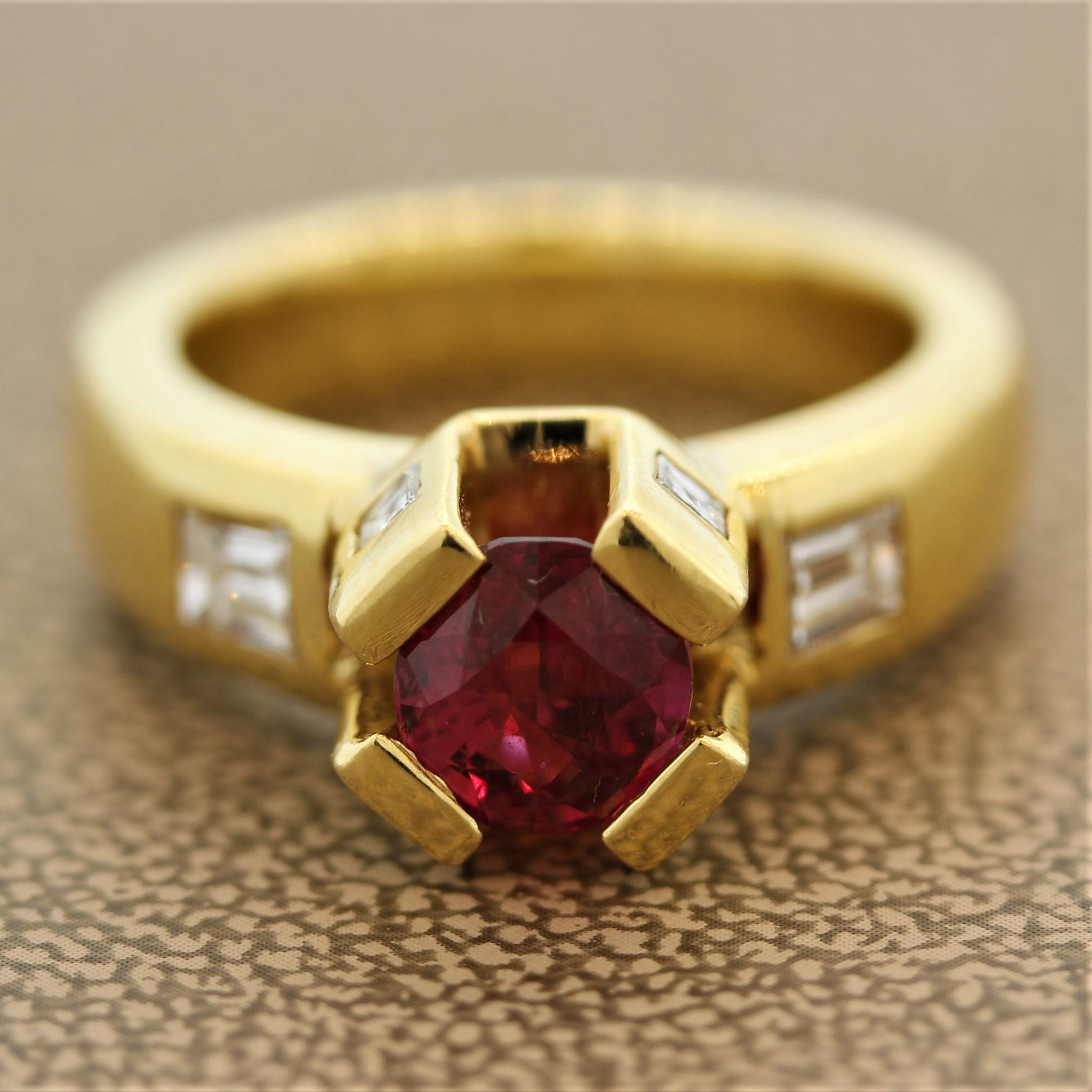 A royal ruby ring! It features a round cut ruby weighing 1.45 carats with a bright vivid red color. It is set in large and tall yellow gold prongs that resemble a crown. The ring is accented by 0.66 carats of baguette and square cut diamonds. Made