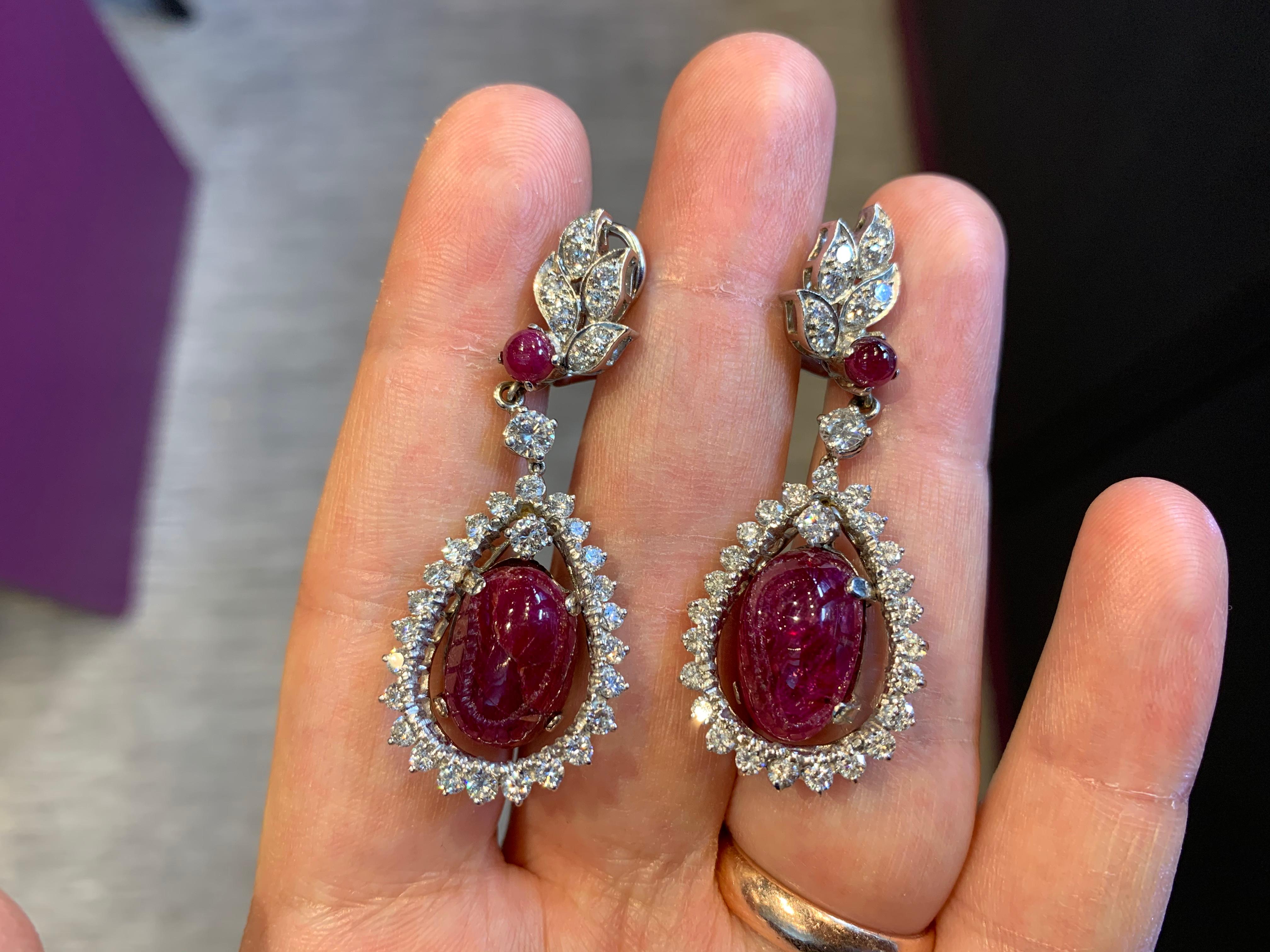 Ruby & Diamond Dangle Drop Earrings
68 round cut diamonds
4 cabochon rubies
Measurements:  1.75