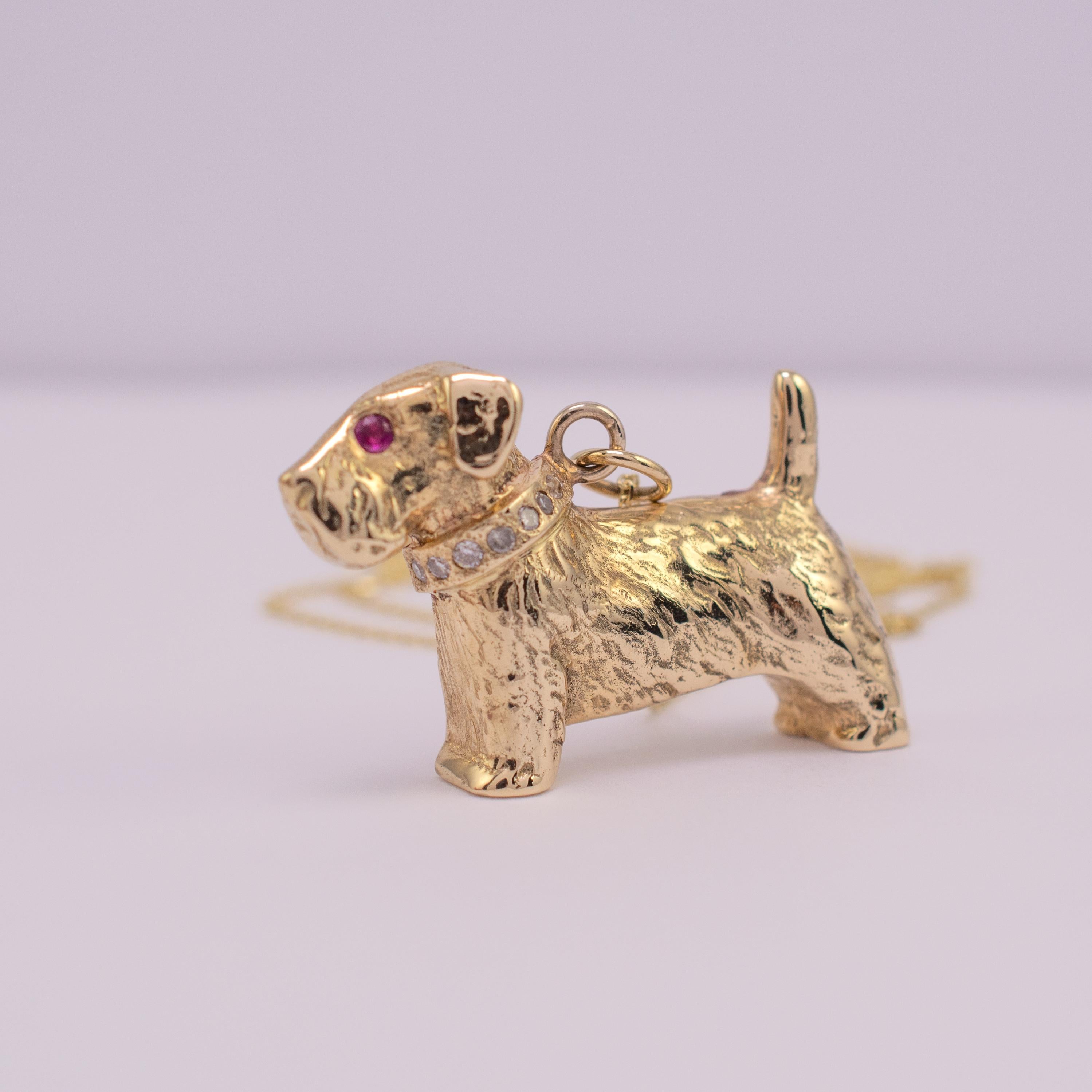 A fabulous 9 karat gold pendant modeled as a Sealyham terrier dog with a ruby eye and 0.8 carats of diamonds set into the collar.

The piece is assay hallmarked and comes complete with complimentary 16