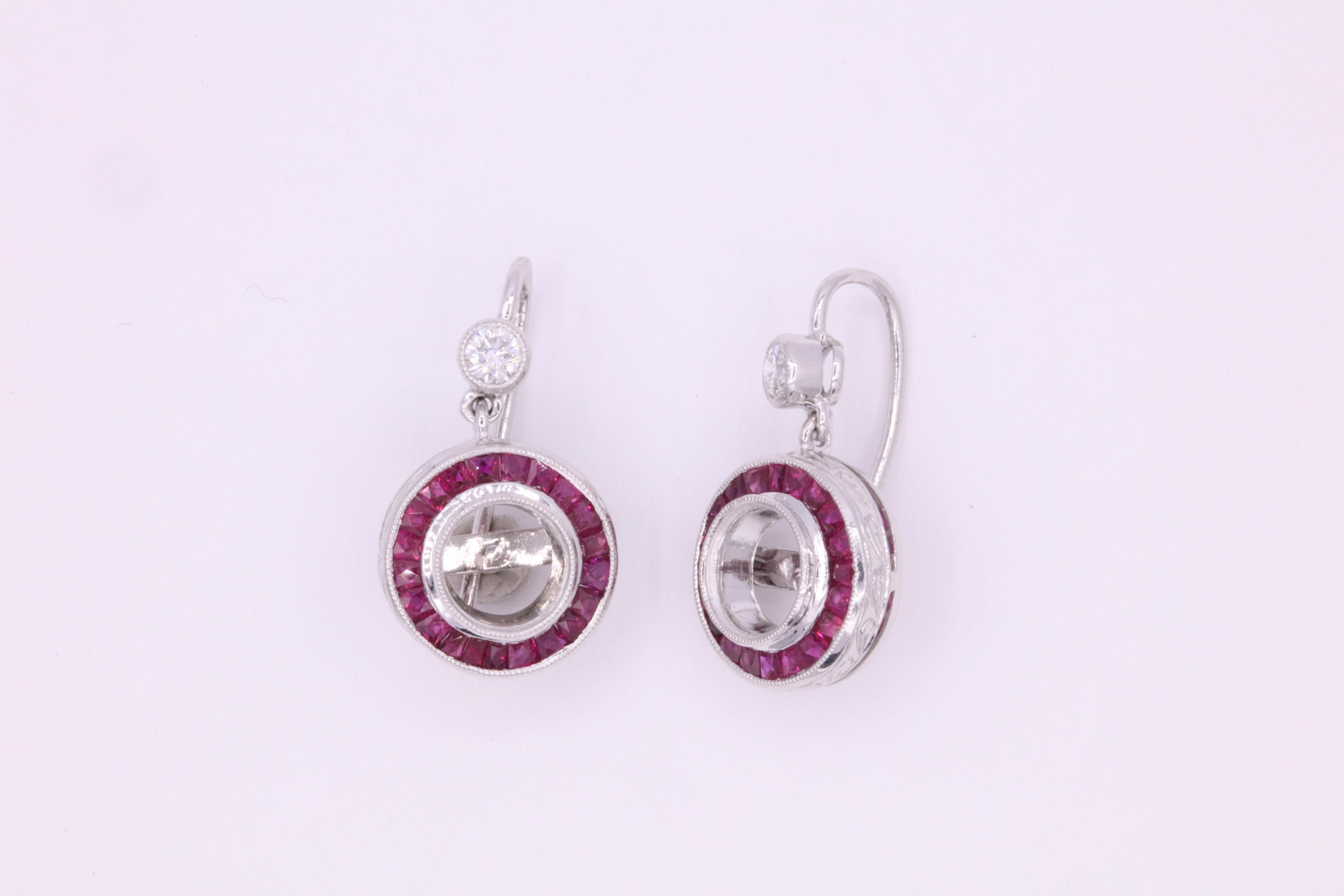 Art Deco inspired drop earrings featuring two round brilliants weighing 0.24 carats with red rubies weighing 1.44 carats, crafted in platinum. 

Harbor Diamonds can mount your own diamonds, pearls or any gemstones. 