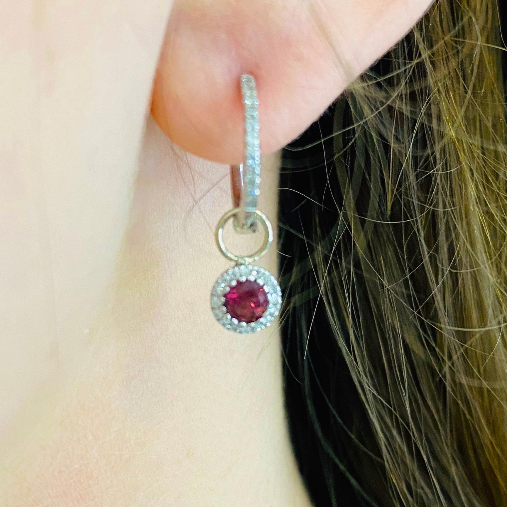 These stunning earring charms are the perfect way to dress up any pair of hoops! With polished 14k white gold surrounding a brilliant round red ruby and dripping with white diamonds, these charms make the perfect chic and modern accessory for any