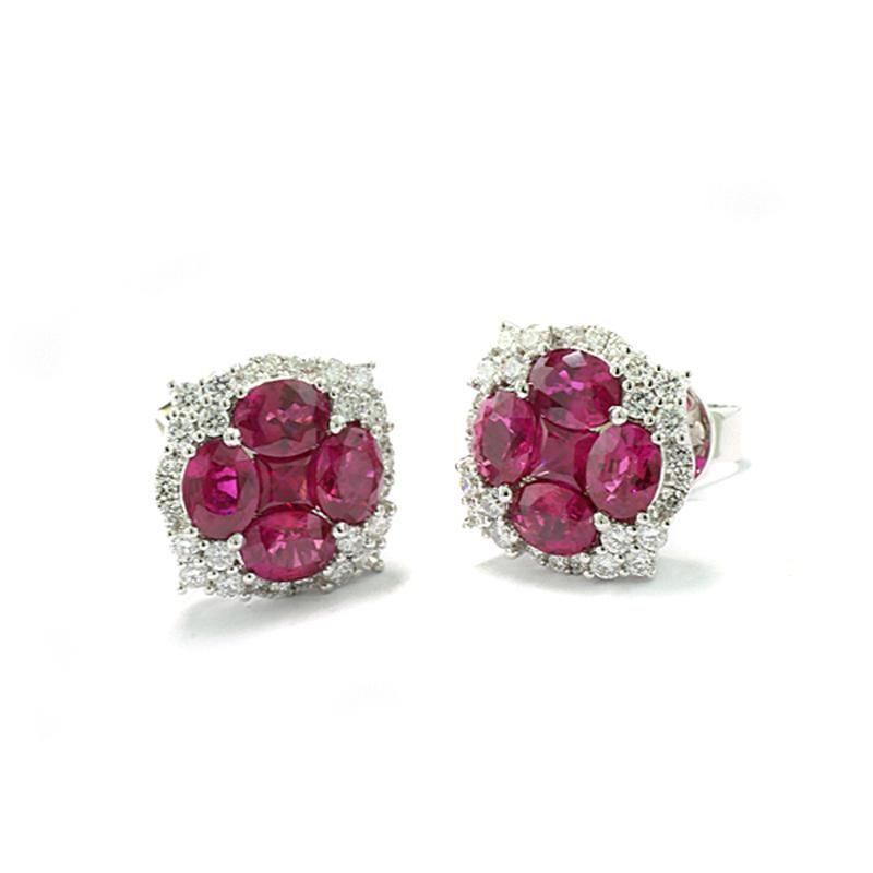 A pair of opulent gemstone stud earrings with elegant design. The pair features a total of 10 rubies, including two square-cut and 8 oval-cut rubies, totaling approximately 2.70 carats. The rubies display an intense red with very good transparency.