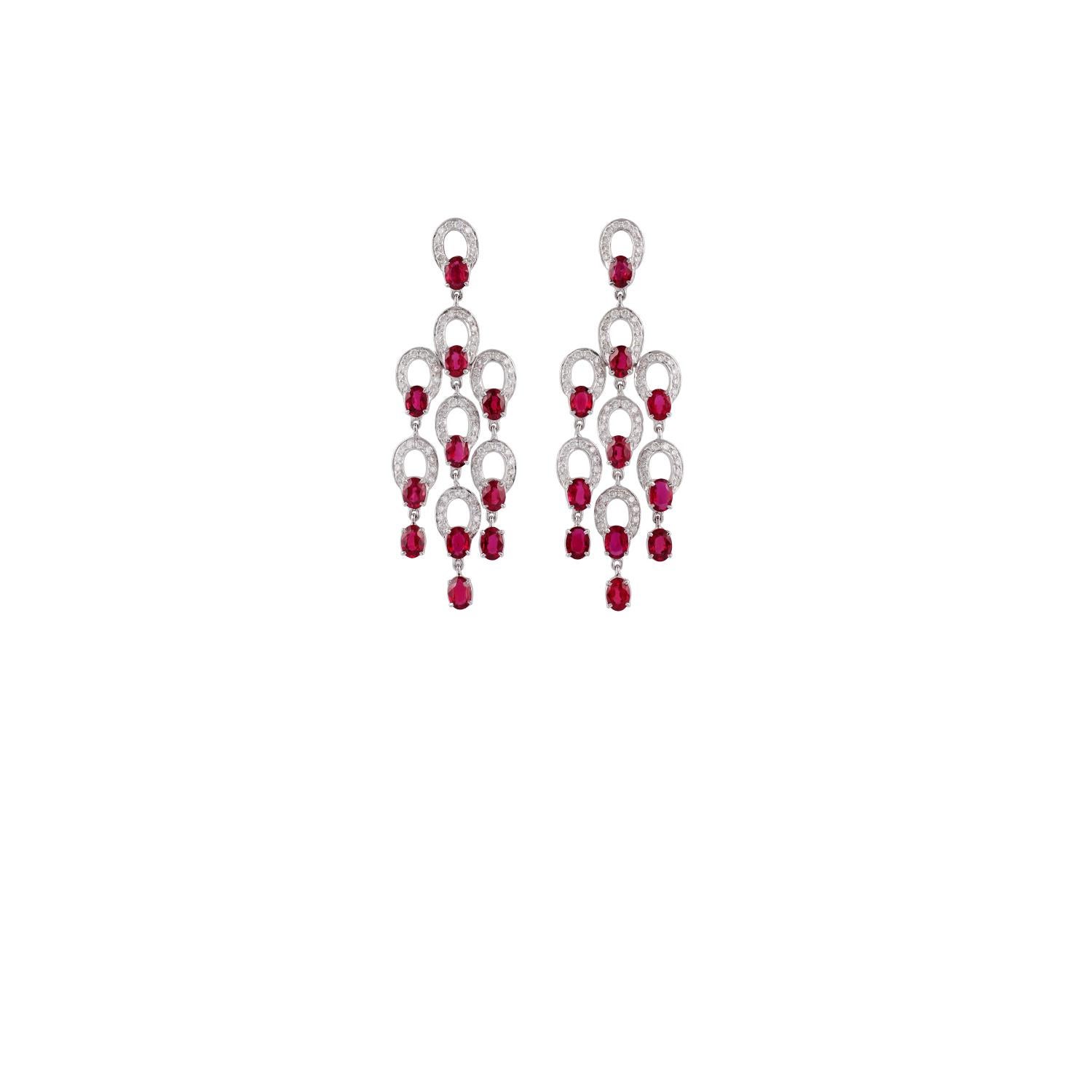These are an elegant chandelier earrings features 22 pieces of oval shaped rubies weight 7.80 carat with round shaped diamonds weight 1.84 carat, these earrings are entirely made in 18K white gold weight 11.95 grams, earrings have a simple pull-push