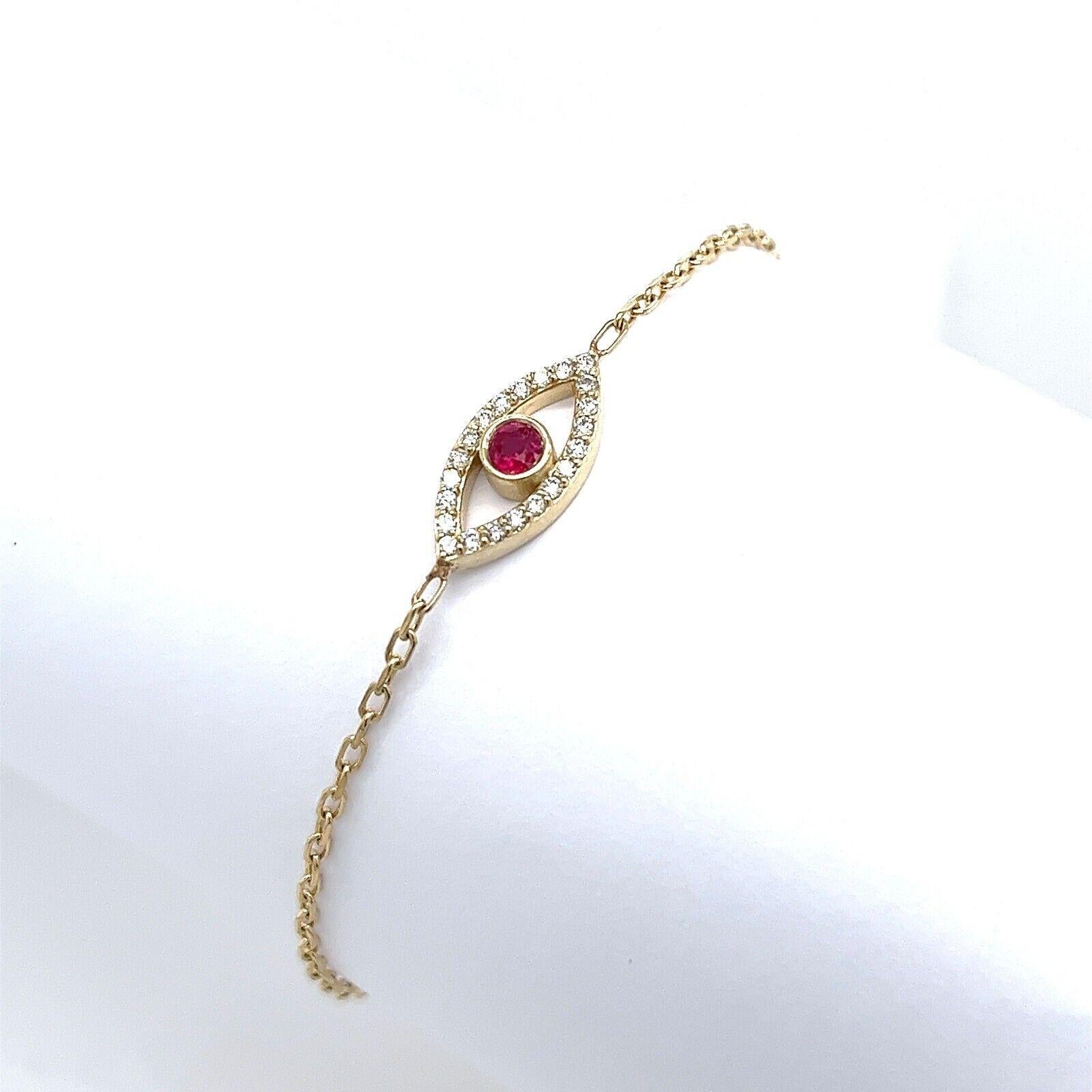 Made by Jewellery Cave- our exquisite diamond & Rubyset evil eye bracelet—an enchanting fusion of style and symbolism. Crafted in 9ct yellow gold, this fashion-forward accessory embodies eleganceand spirituality. The centerpiece of this mesmerizing