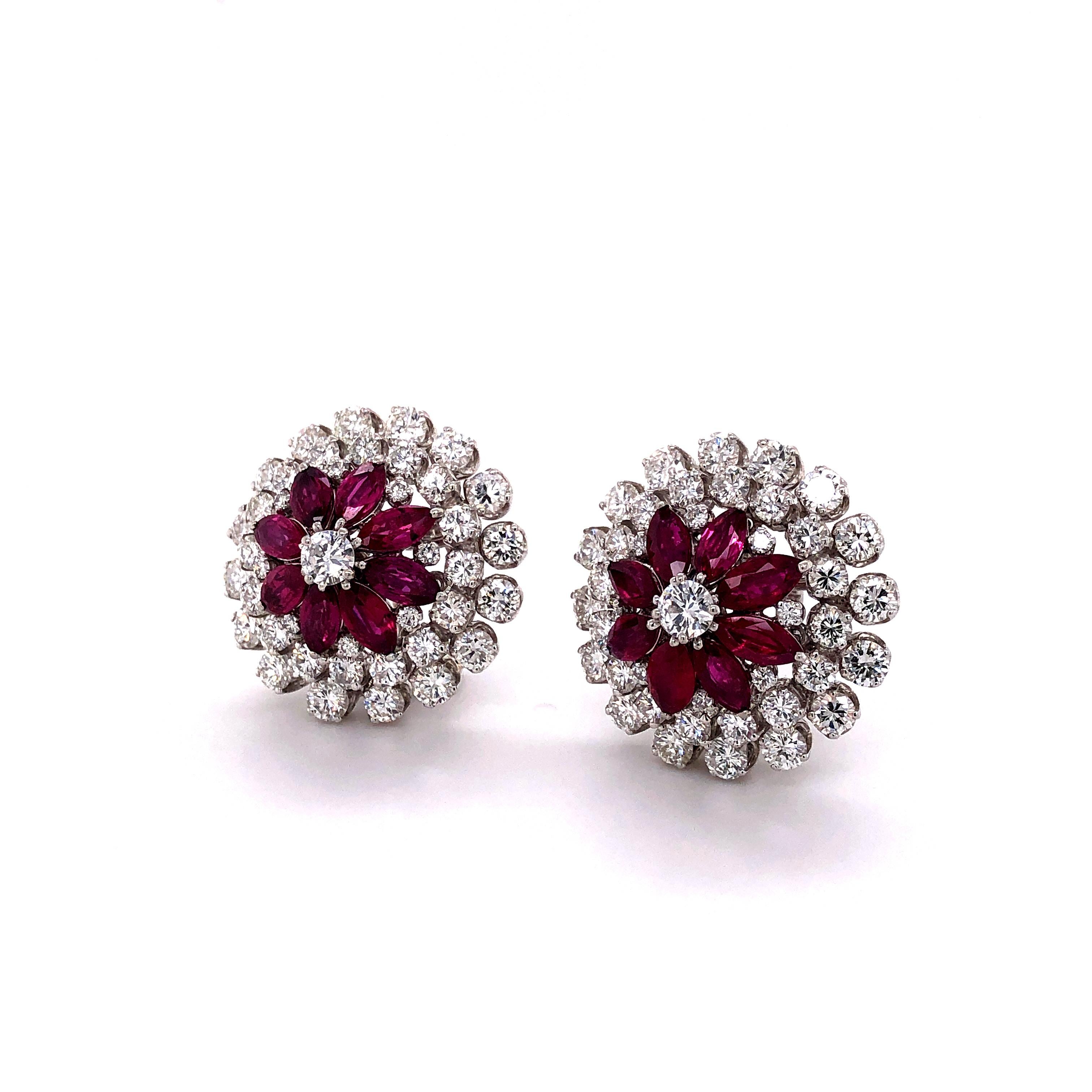 Charming pair of platinum earclips featuring 16 glowing marquise shaped rubies, total weight approximately 4.00 carats. Surrounded by 82 brilliant-cut diamonds of G and H color and vs clarity, total weight approximately 6.00 carats.

btw we have a