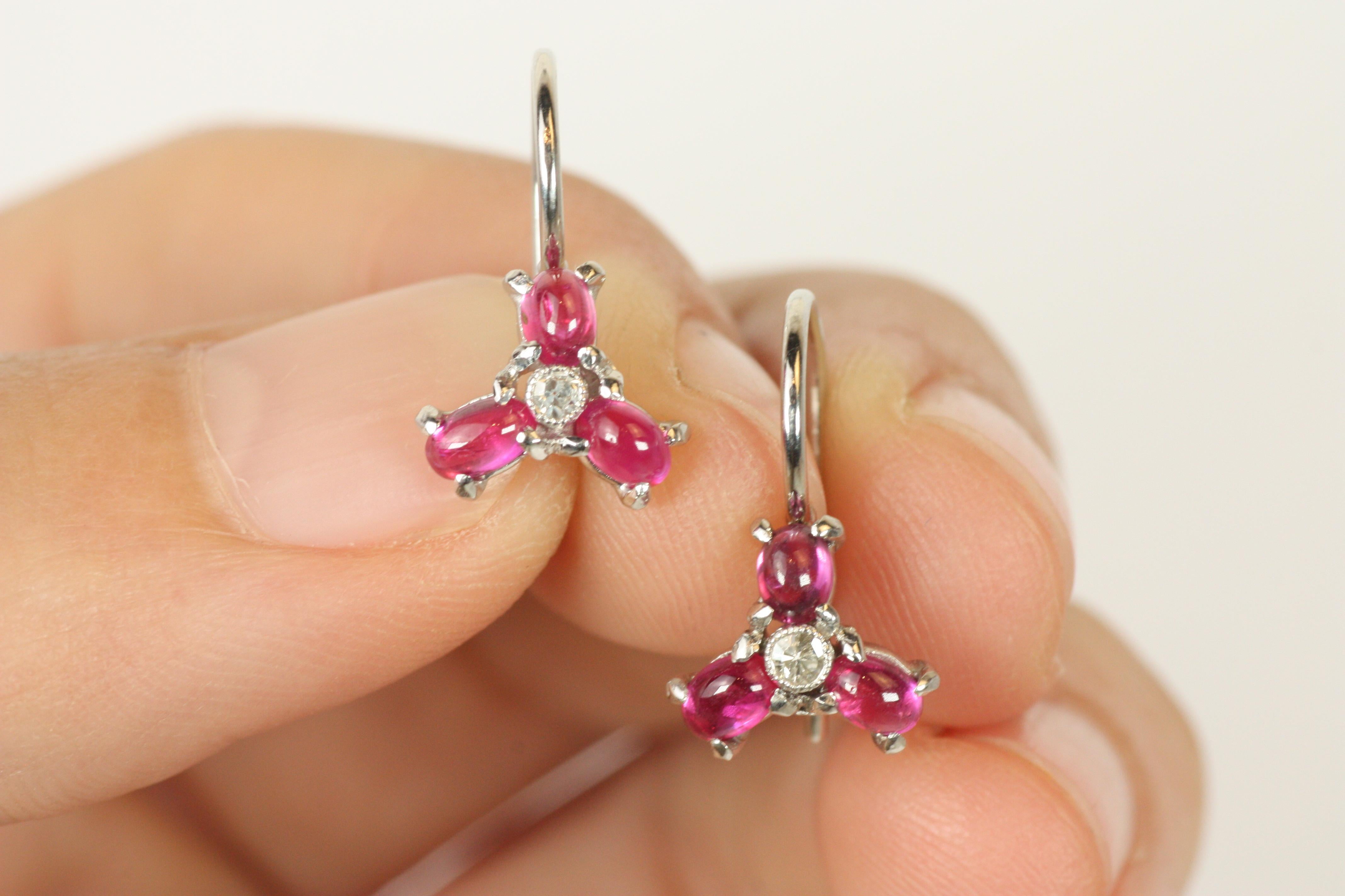Round Cut Ruby Diamond Flower Floral Earrings in Platinum by Bracken Jewelers For Sale