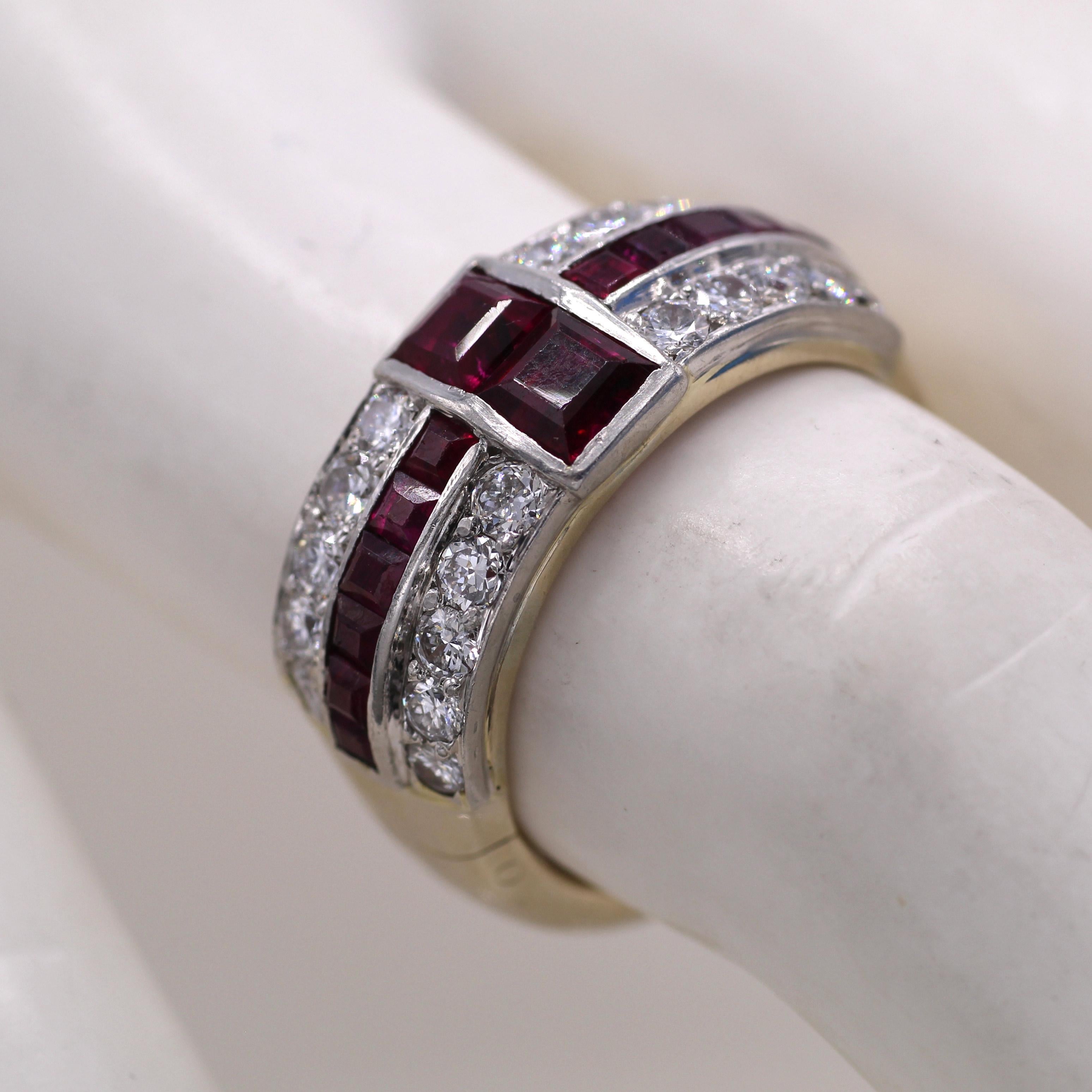 Set with beautiful burgundy red rubies and bright white and lively round brilliant cut diamonds, this band displays a wonderful contrast of colors. The band has a custom 