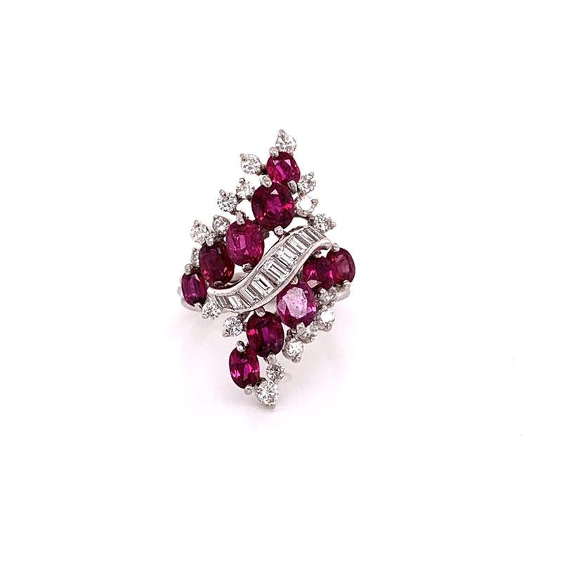 A unique bypass ring featuring approximately 3 carats of oval shaped rubies. It is accented with approximately 1 carat of round and baguette cut diamonds set across this hand fabricated 18k white gold ring. 


Ring Size 7.5

