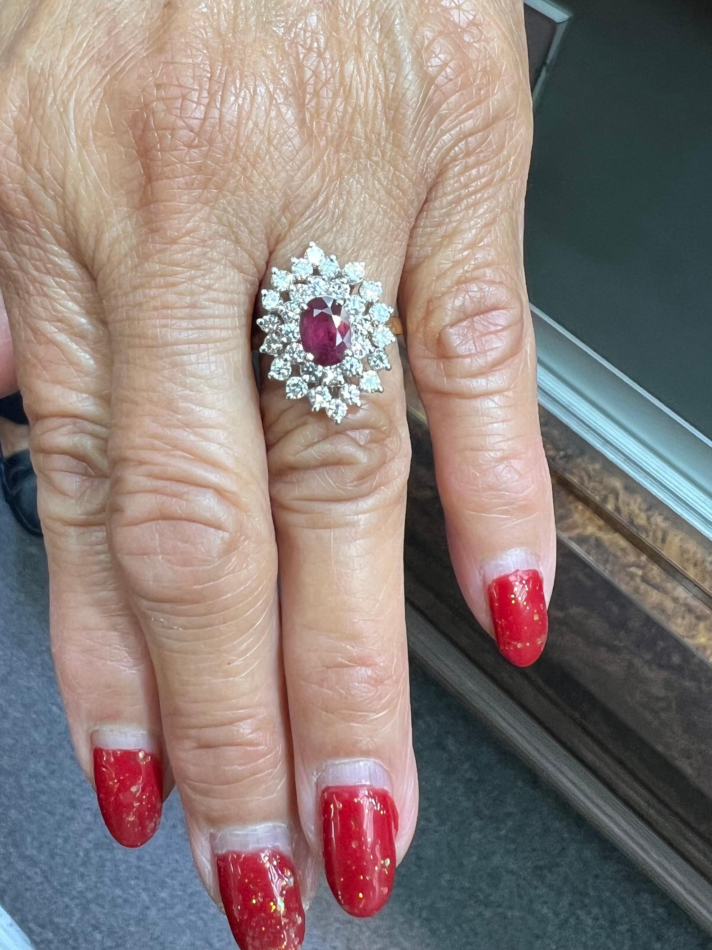Oval Ruby Diamond 14k Yellow Gold Cluster Ring circa 1980s. *

The Oval Ruby and Diamond 14k Yellow Gold Cluster Ring was made in the 1980s.  The Ruby displays a pleasing red color and is surrounded by round brilliant cut diamonds.  According to the